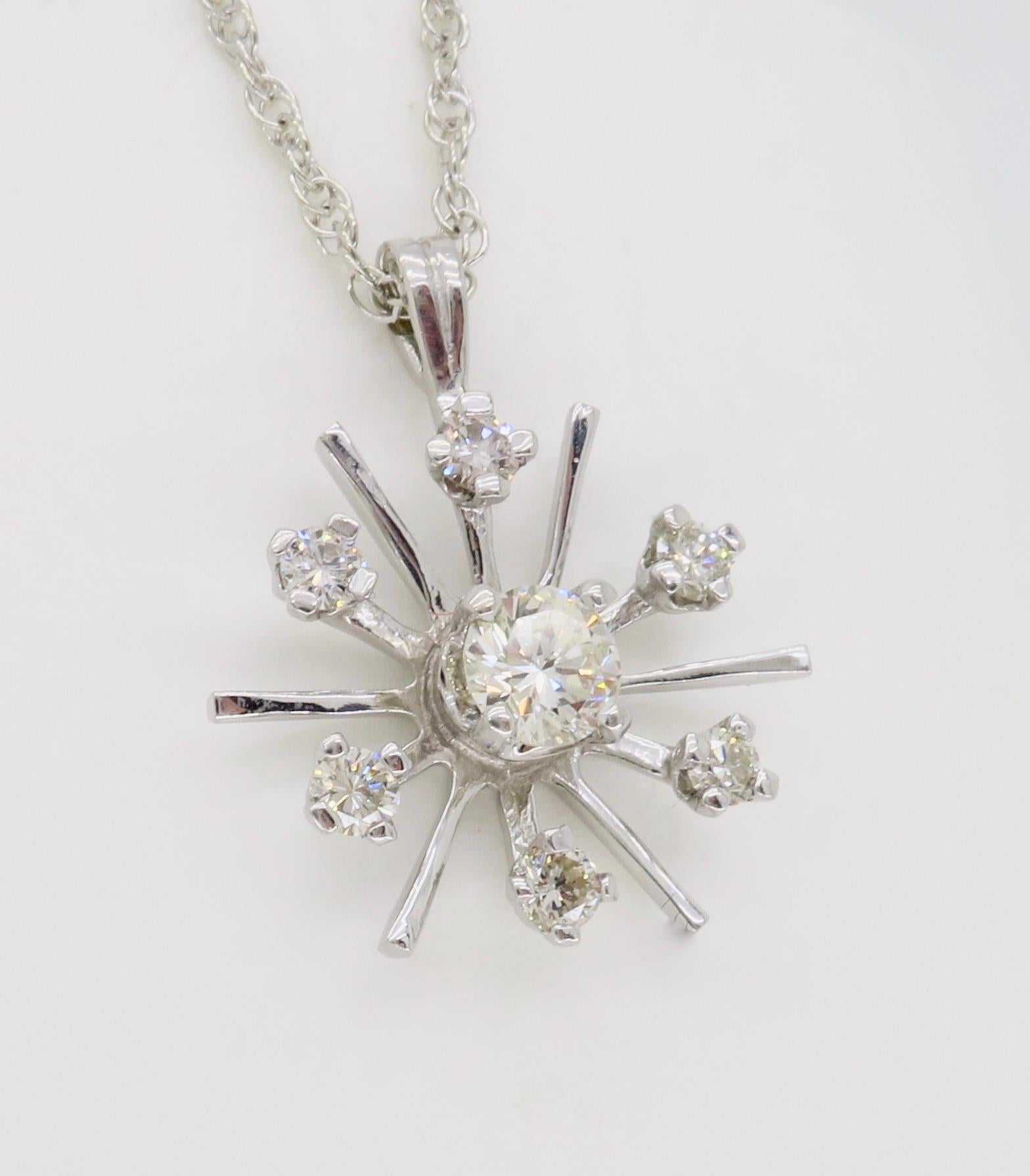 Starburst diamond pendant necklace made in 14k white gold.

Diamond Carat Weight: Approximately .50CTW
Diamond Cut: Round Brilliant Cut Diamond
Metal: 14K White Gold
Chain Length: 17.5” Long
Marked/Tested: Stamped “14K