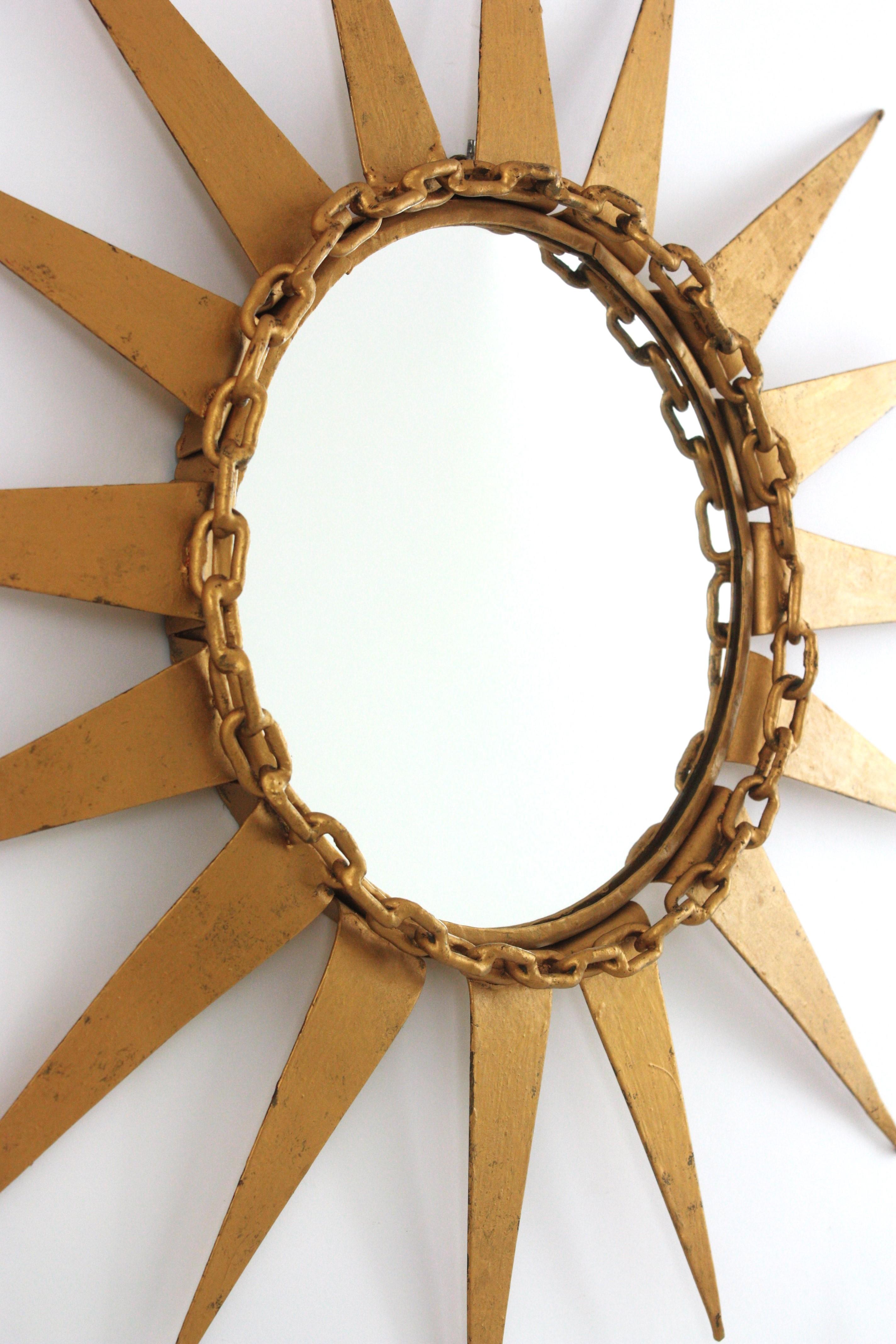 Brutalist Starburst Sunburst Mirror in Gilt Iron with Chain Link Motif, Spain 1950s For Sale