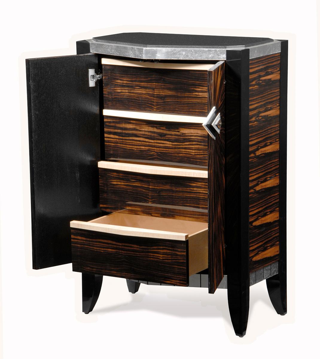Chevron Accent Cabinet Chest of drawers New York Version is part of the Chevron series. It has a black granite top with a silver leaf sub top which complement the starbust ebony macassar doors. There are jet black maple legs and leg tops which