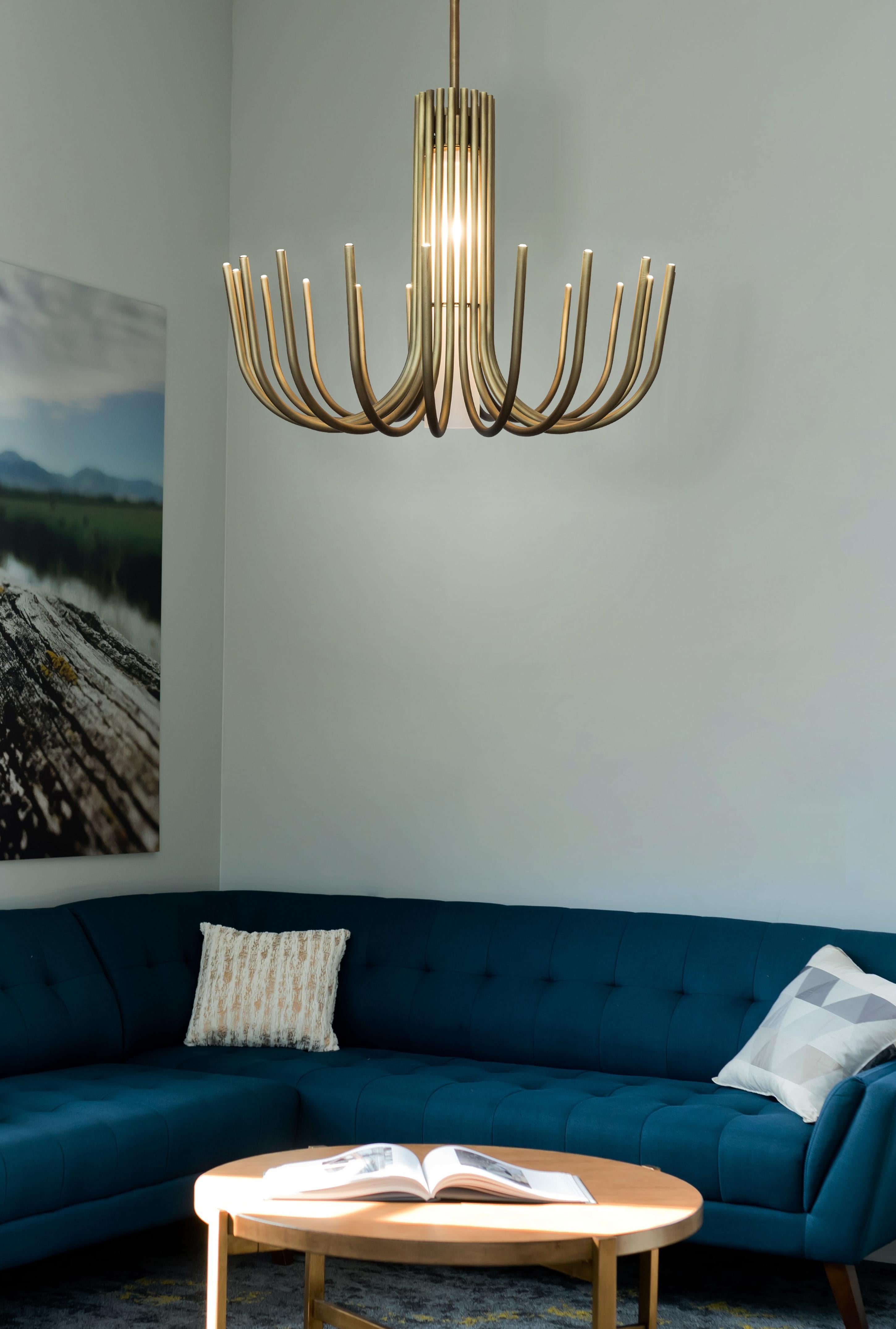 Inspired by the big classic chandeliers, but with a more essential look given by the use of metal without any additional decorative element. Stardust provides a double illumination, provided by the microled positioned at the upper ends of the