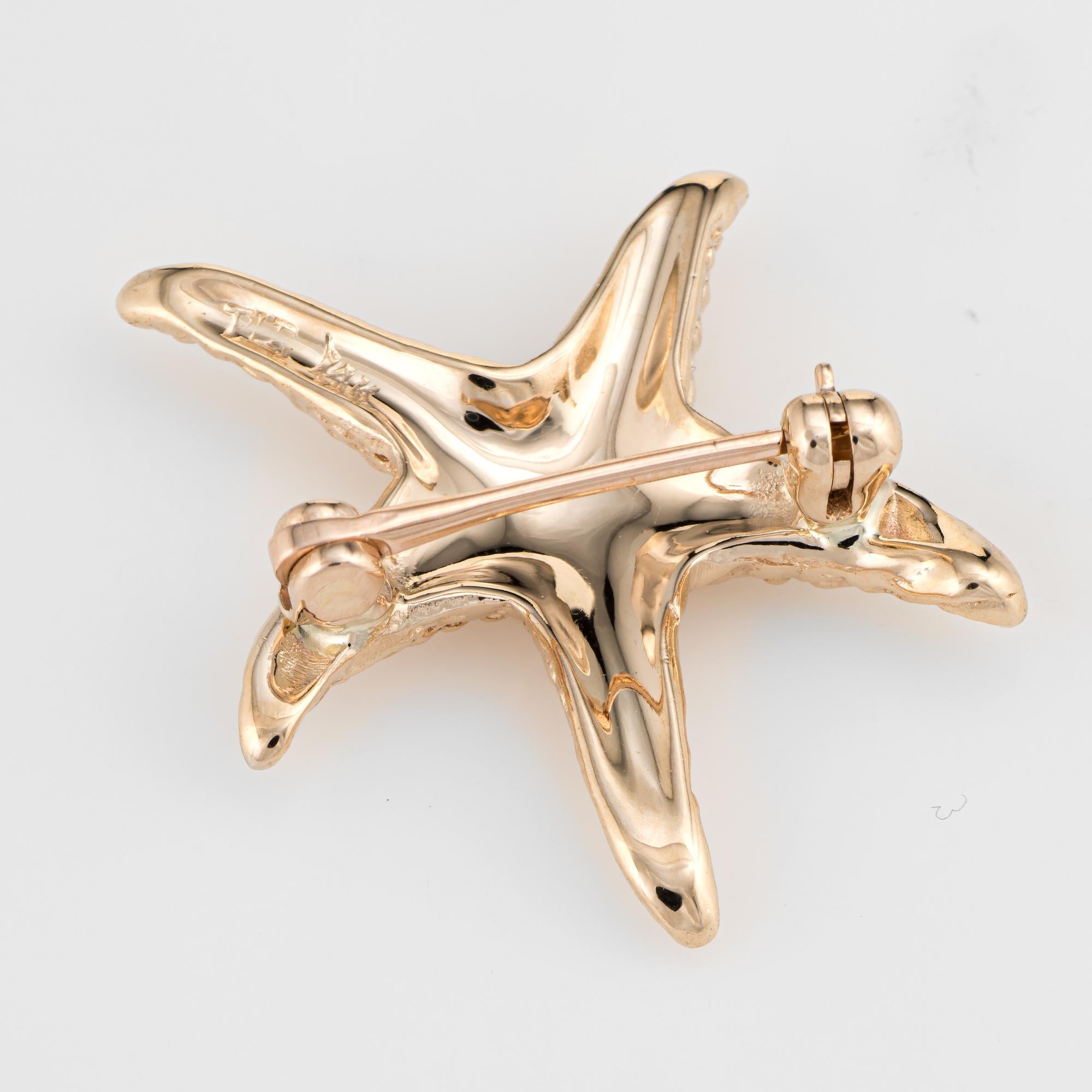 Charming starfish brooch crafted in 14 karat yellow gold. 

The starfish features a textured lifelike design. A charming piece to wear on a lapel or pinned to your clothing (I like to pin on a shirt cuff for a different look). 

The brooch is in