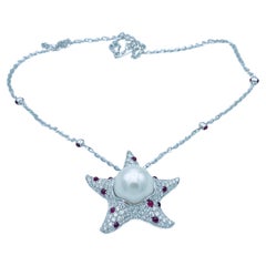 Pendentif/ collier étoile de mer en or 18 carats, diamant blanc, rubis et perle d'Australie