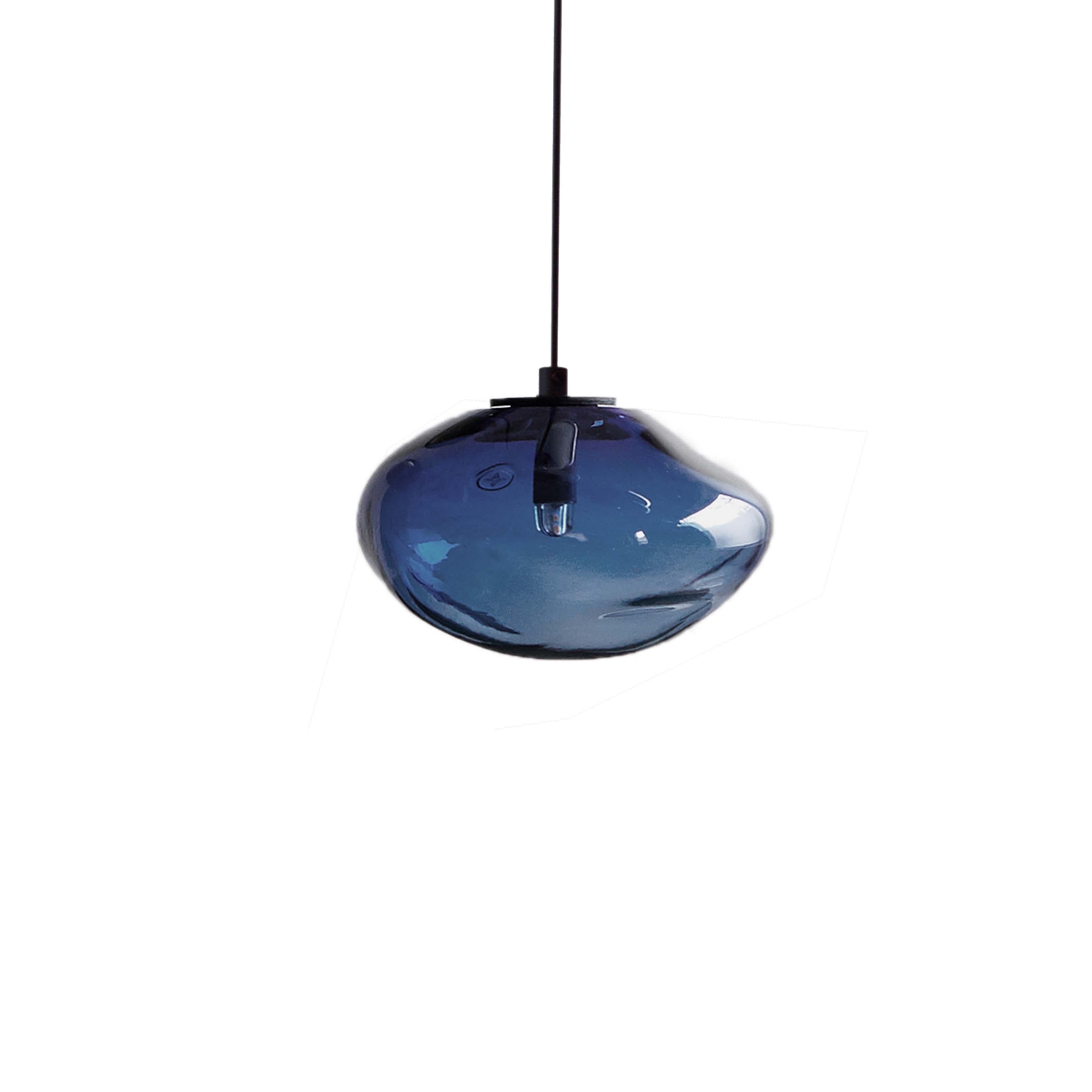 Starglow steel blue pendant by Eloa.
No UL listed 
Material: glass, steel, silver.
Dimensions: D 15 x W 13 x H 100 cm
Also available in different colours and dimensions.

All our lamps can be wired according to each country. If sold to the USA it