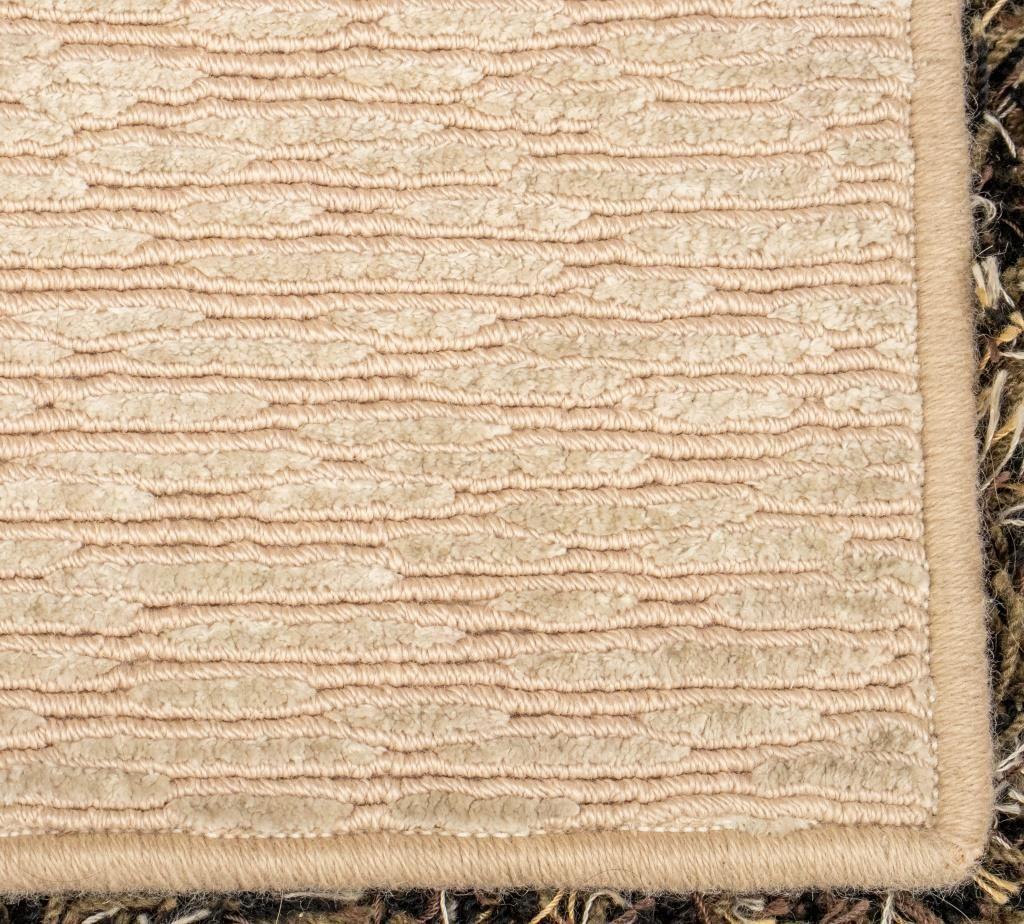 Stark modern cream striped wool carpet, label to underside. 

Dealer: S138XX