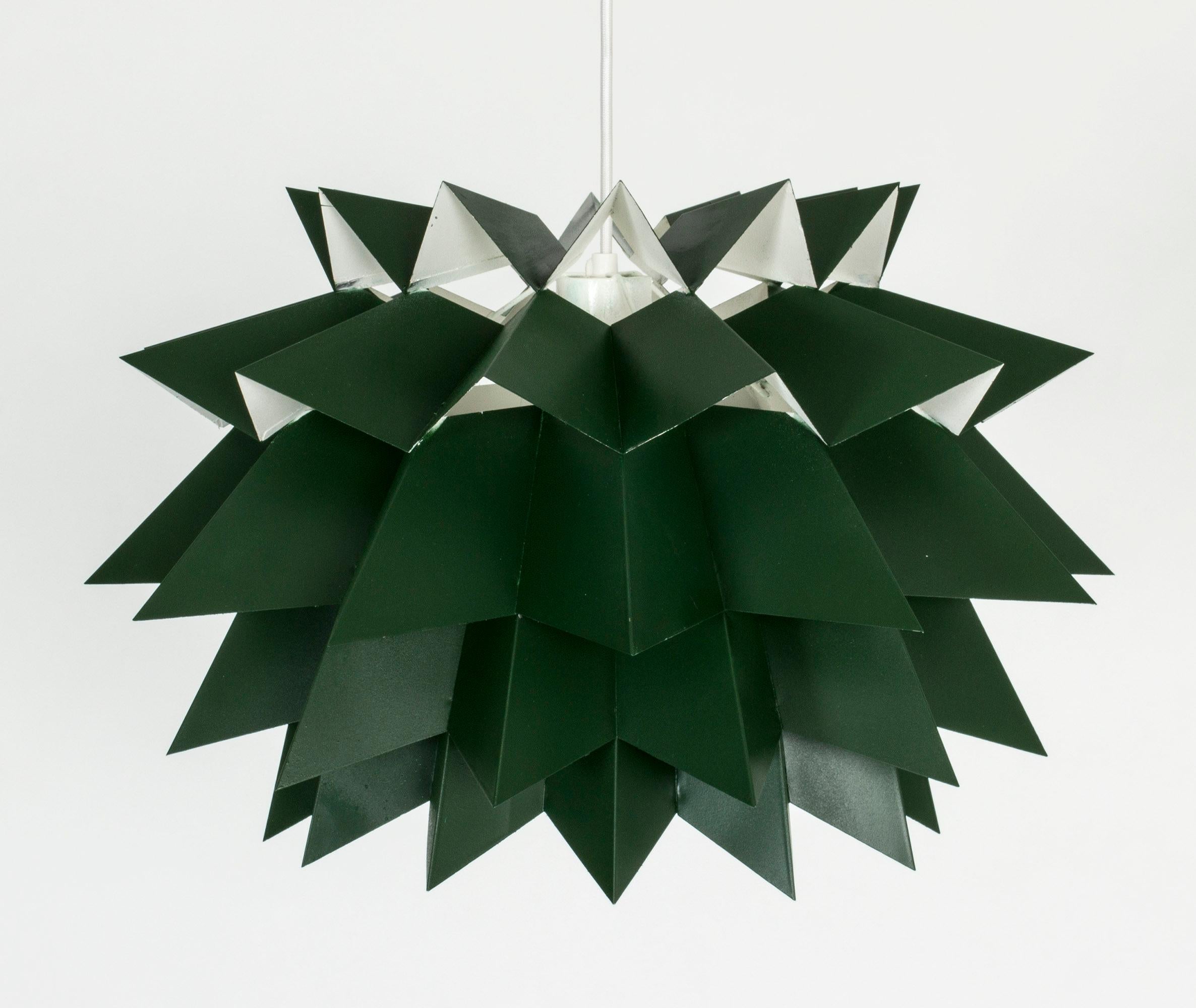 Striking “Starlight” pendant lamp, also referred to as “Sydney light”, by Anton Fogh Holm and Alfred J. Andersen. Lacquered dark green on the outside, white on the inside.