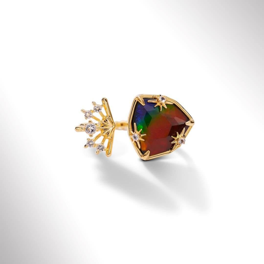 Product Details:

The Starlight collection features a twinkling fusion of trillion-cut Ammolite and 18K gold vermeil, inspired by the diffusing light of stars.

AA grade Ammolite
13.9mm x 14mm trillion Ammolite double ring
18K gold vermeil
Accented
