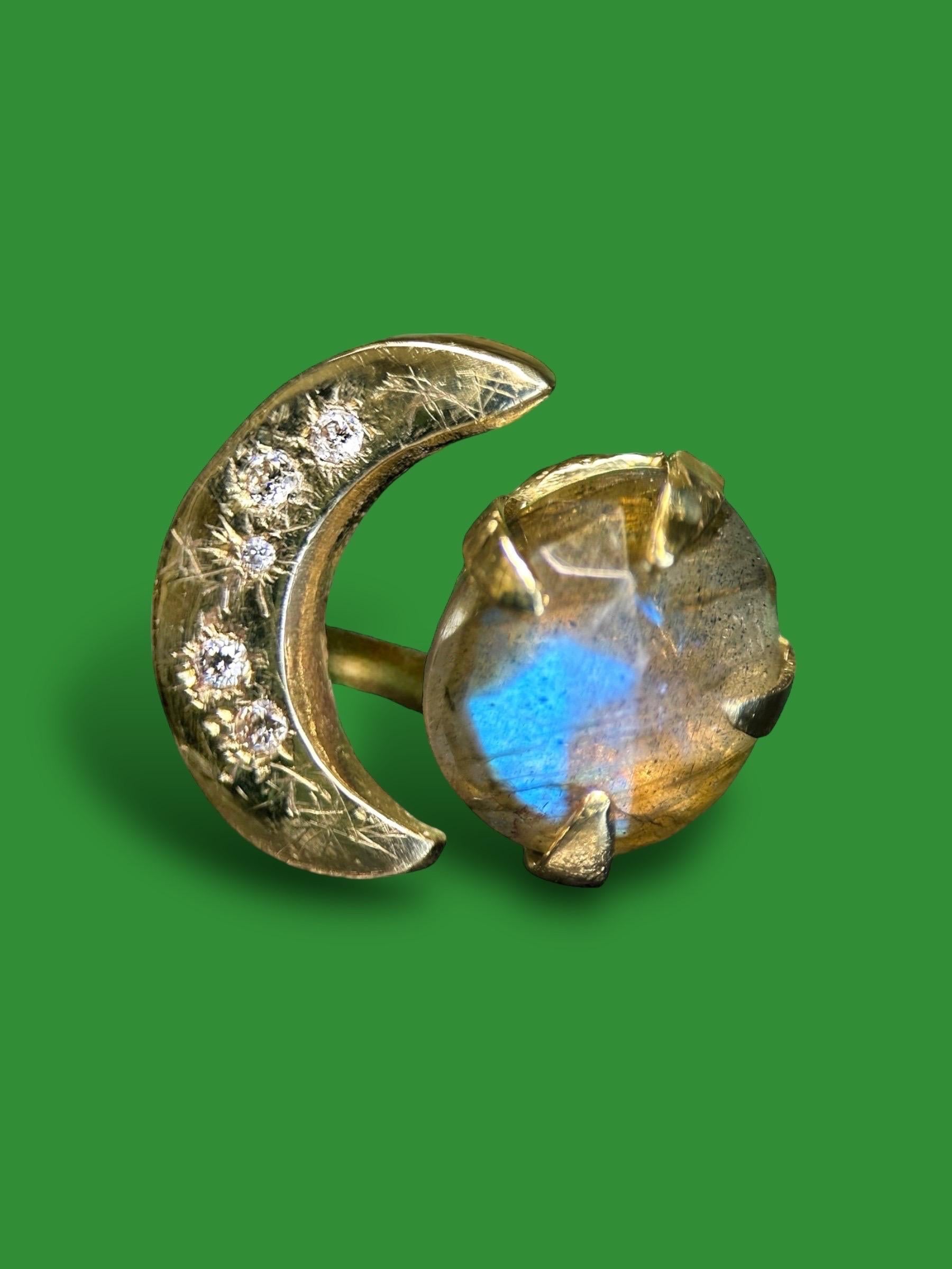 Introducing our exquisite handcrafted Moon Crescent Ring with Diamonds and a Labradorite ring in 14k yellow gold.

Crafted with meticulous attention to detail, this ring features a delicate moon crescent design that symbolizes the beauty and mystery