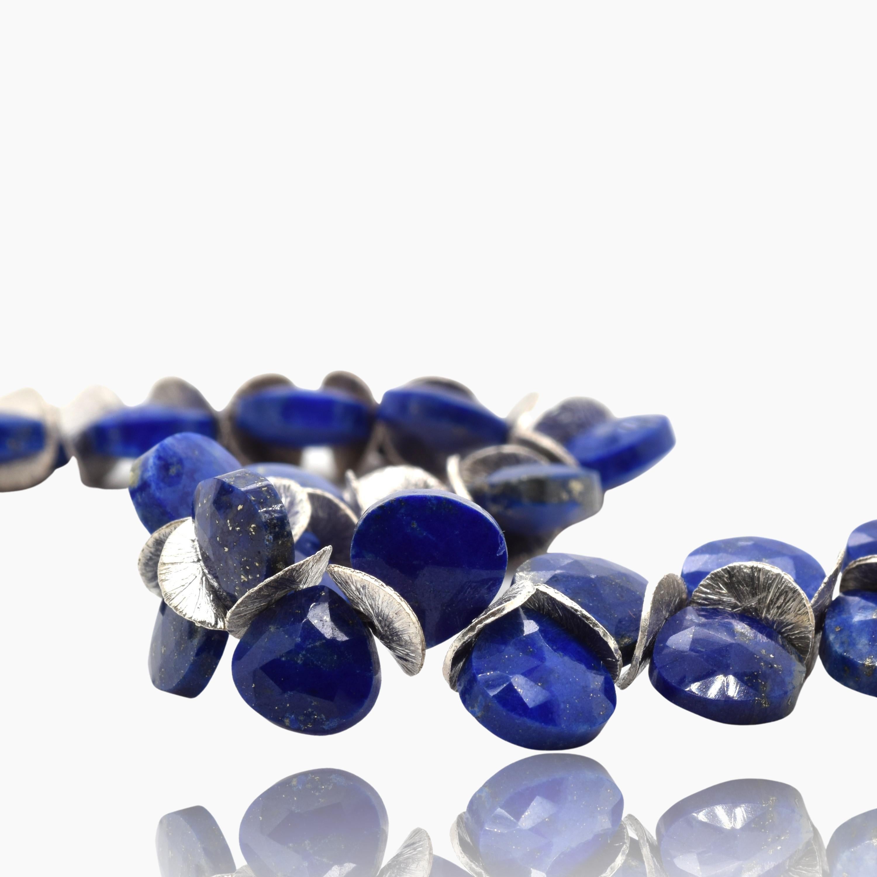 My signature bracelet with dark blue faceted lapis gems with sterling silver discs and a sterling spring ring clasp. Wear casually or dressed up -- it can go either way! Available in Small (6-7
