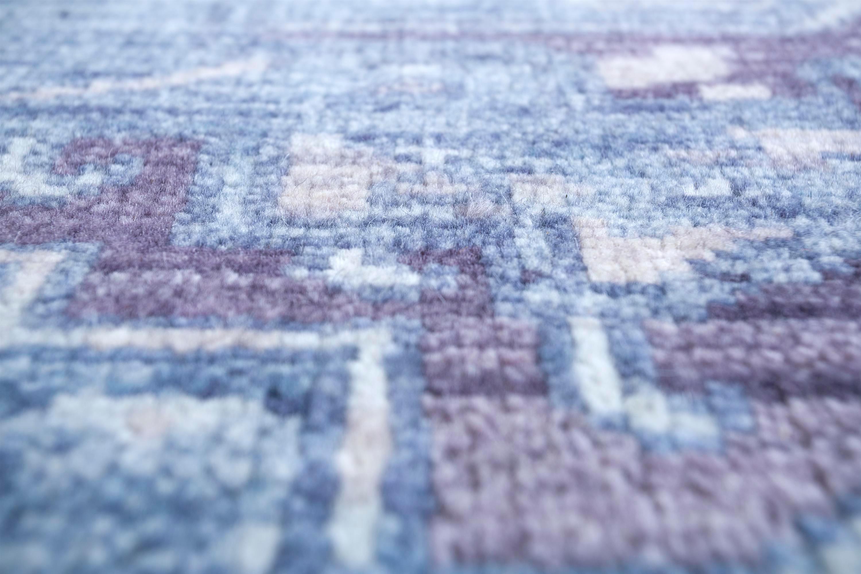 Dive into the regal allure of this handcrafted beauty from our Savana collection. This hand knotted carpet introduces an indigo-blue symphony seamlessly blended with castlerock hues, forming a captivating pattern that exudes elegance. The geometric
