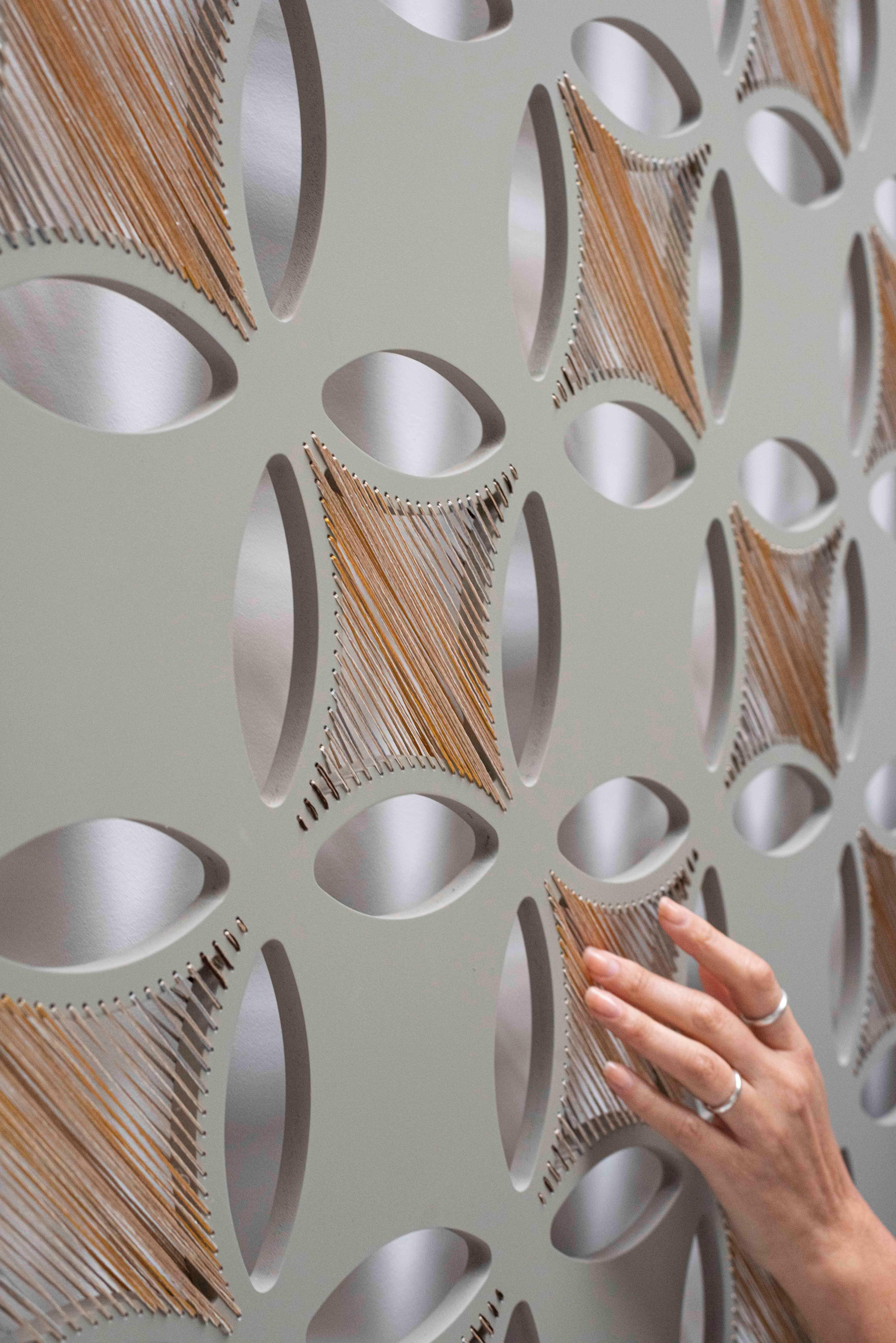 Other Specifications: 
- PVC panel hand woven with silk and cotton threads. 
- Color: This threaded screen is grey with a matte texture, decorated with yellow, silver and pearl color threads.
- This piece can be installed to walls and uses 6 inox