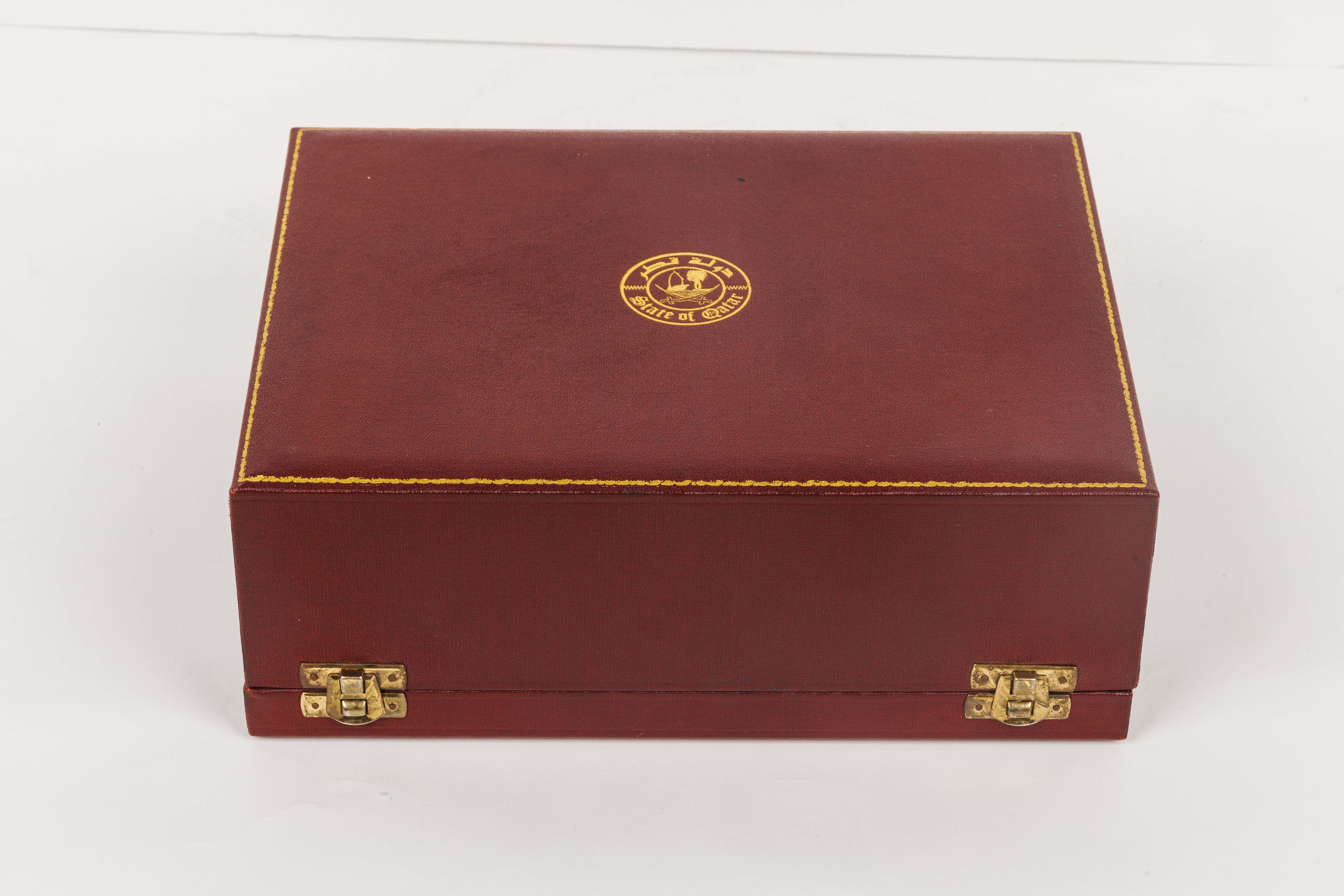 State of Qatar and Grant Macdonald, A Rare Silver Humidor Box in original fitted box depicting the map and flags of The State of Qatar and the Royal seal of the State.

Silverware is a traditional gift in many cultures and Qatar is known for its