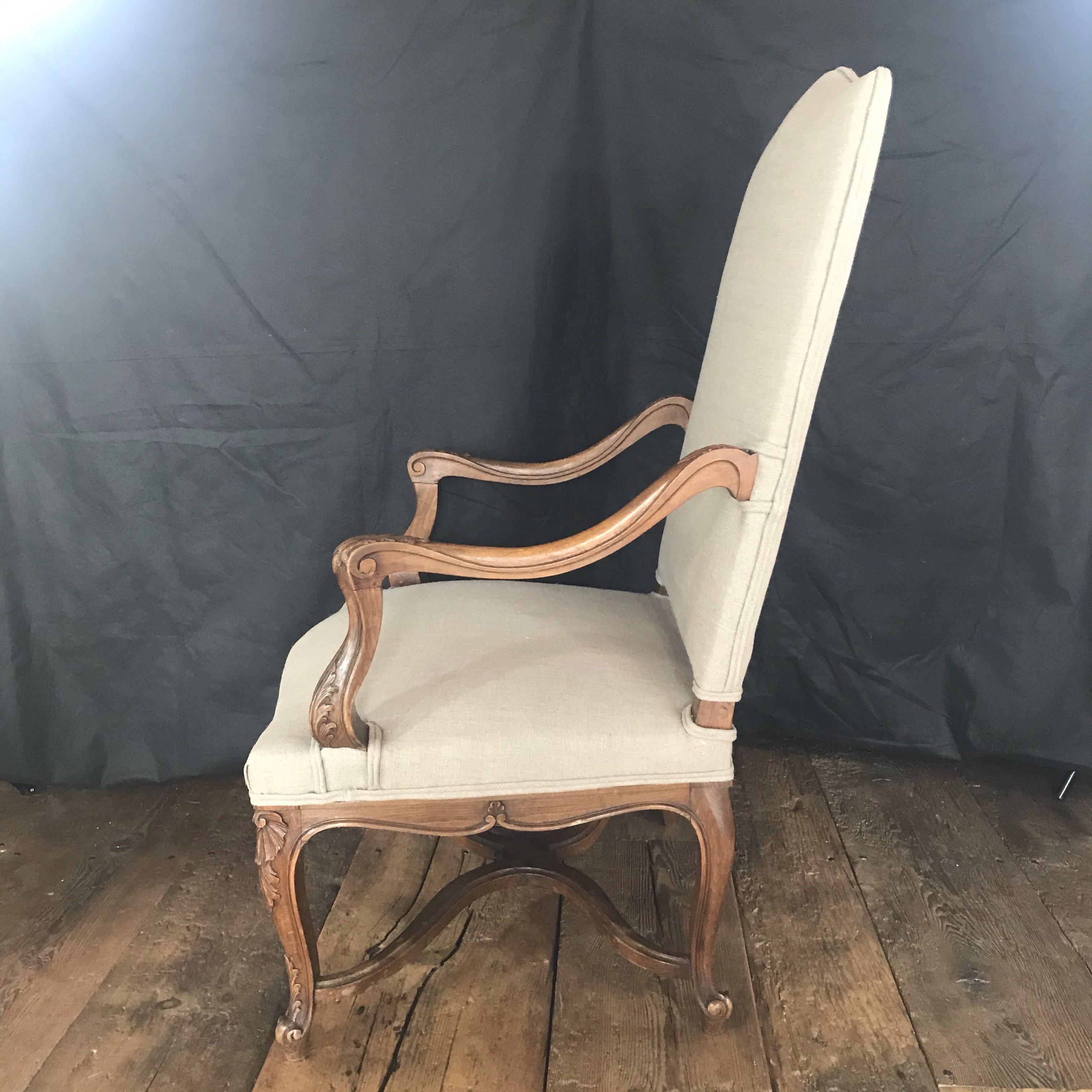 Beautiful 19th century carved walnut French Louis XV armchair with cabriole legs, carved apron with shell motif, and acanthus leaves throughout. Newly reupholstered in a high quality French cotton or linen blend.


 Measures: H seat 19”, D 23.5”