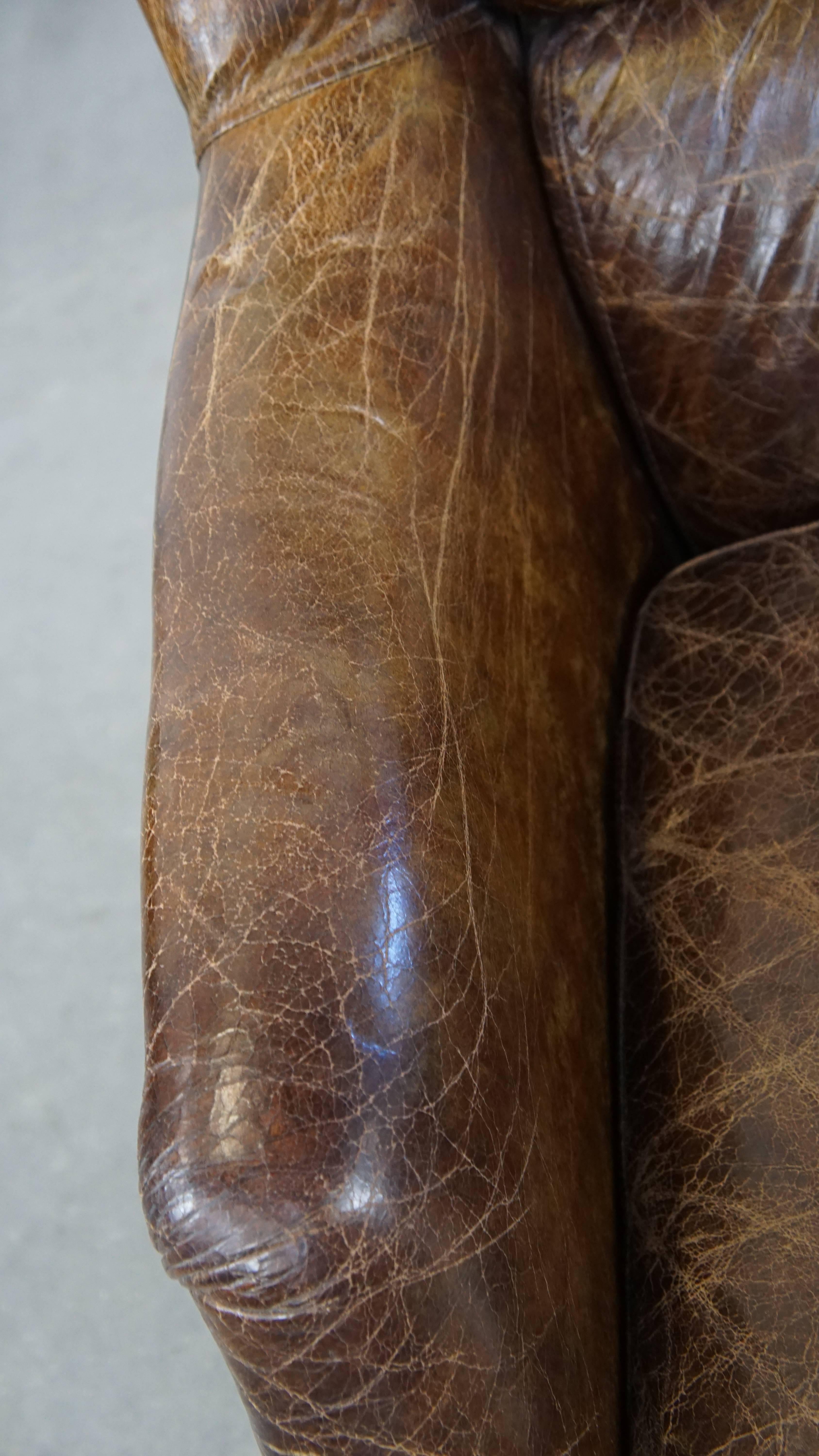 Stately and comfortable grained cowhide armchair with a timeless design For Sale 1