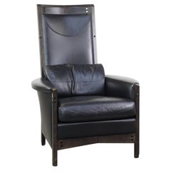 Stately black leather designer armchair by Giorgetti with great seating comfort