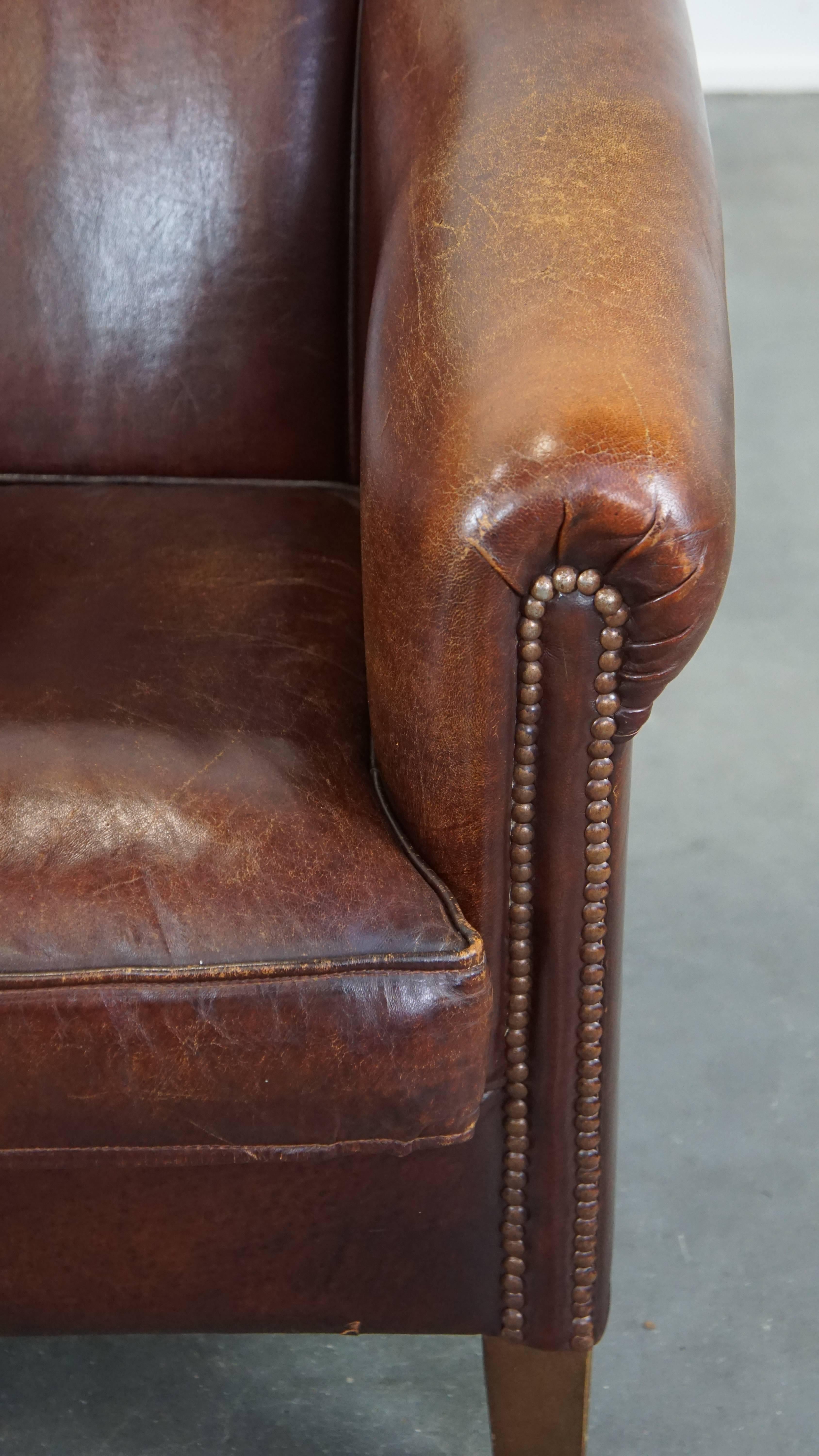 Stately, charming sheepskin club chair, correct finishing with decorative nails For Sale 6