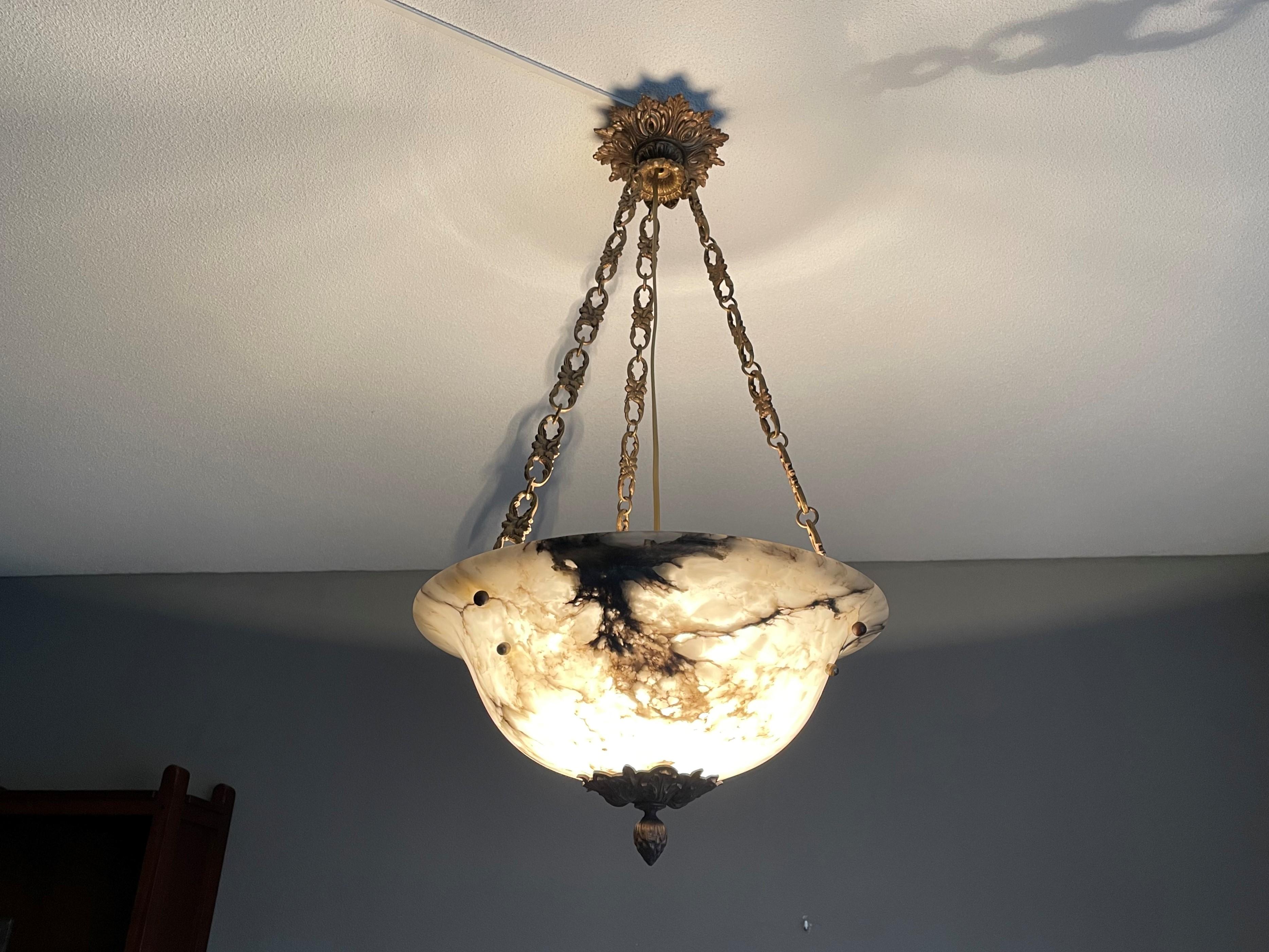 Antique French chandelier from a stately mansion.

If you are looking for a good size, beautiful and ready to use alabaster chandelier then this striking French specimen from circa 1900-1910 could be gracing your home soon. The combination of the