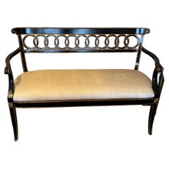 Stately Hollywood Regency Black and Gold Loveseat with Circle Motif