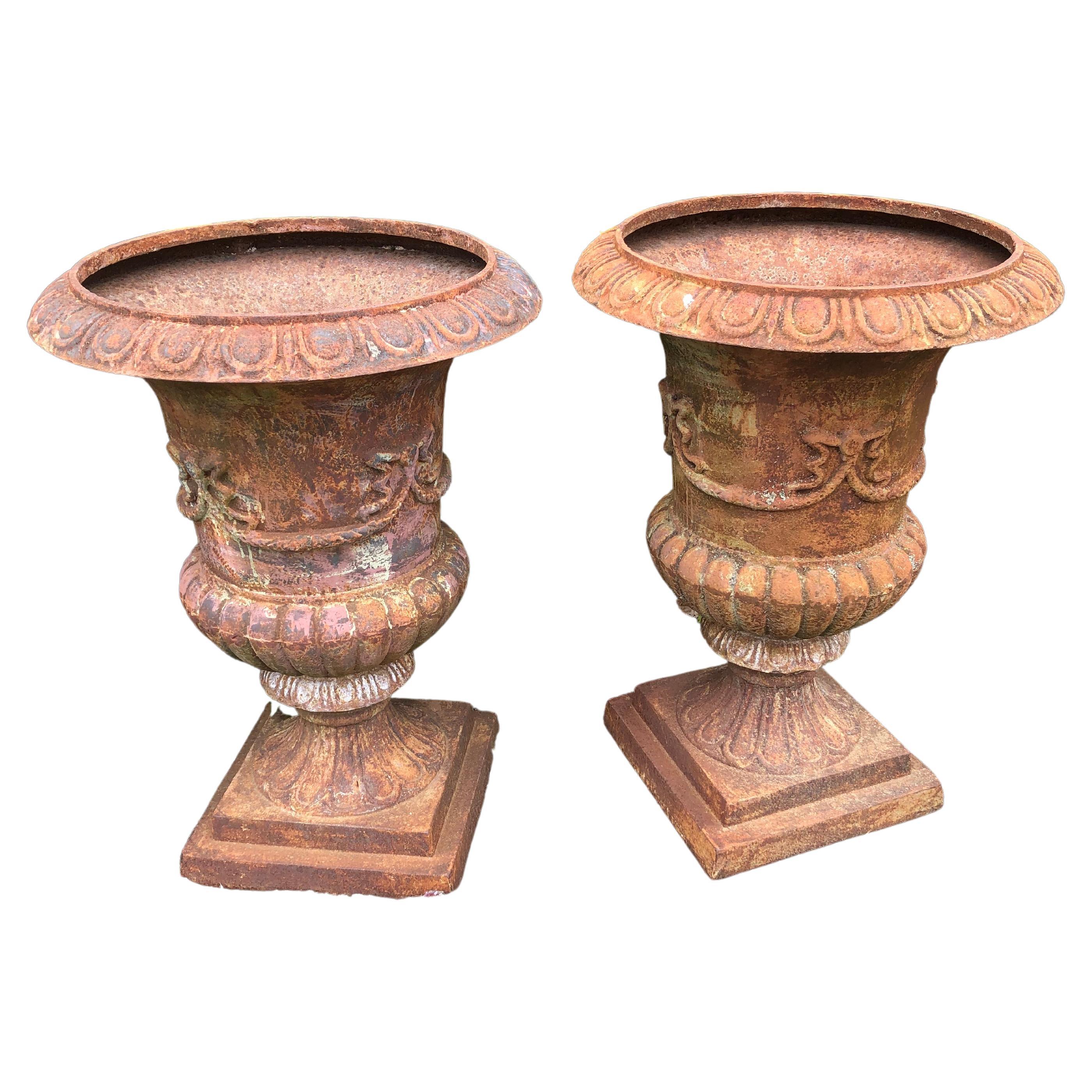 Stately Large Pair of Rust Colored Cast Iron Urn Planters