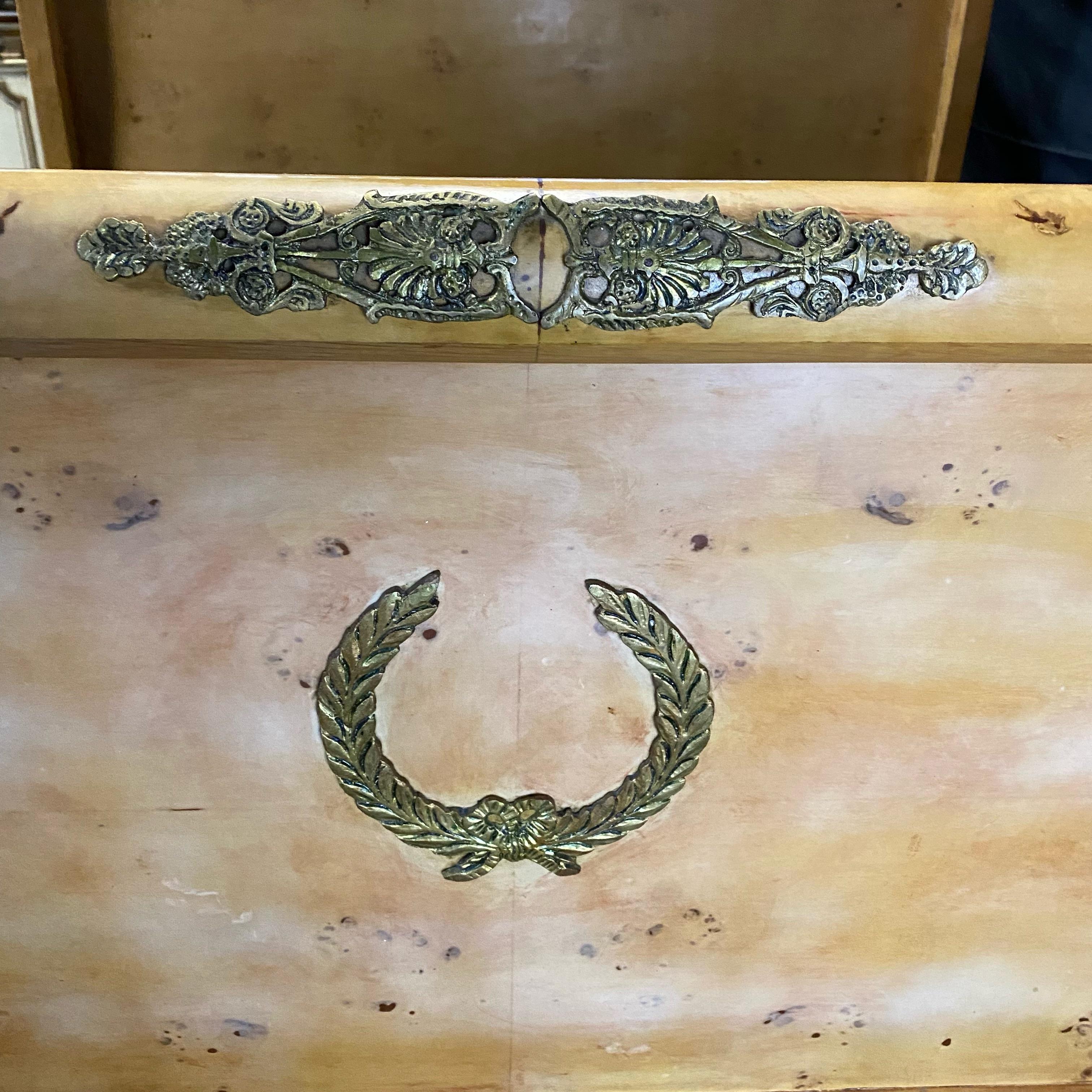 Impressive regal Louis XVI style king size French burled walnut bed frame with a blonde patina, having gorgeous bronze acanthus wreath decoration. Structure is solid.
 footboard 37”H inside width 75” inside depth 81”
#5546.