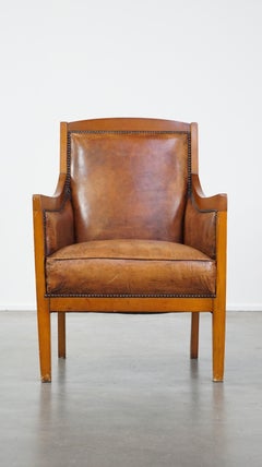 Stately, luxuriöser Sessel aus Schafsleder im Art-déco-Design in Kombination mit Holz