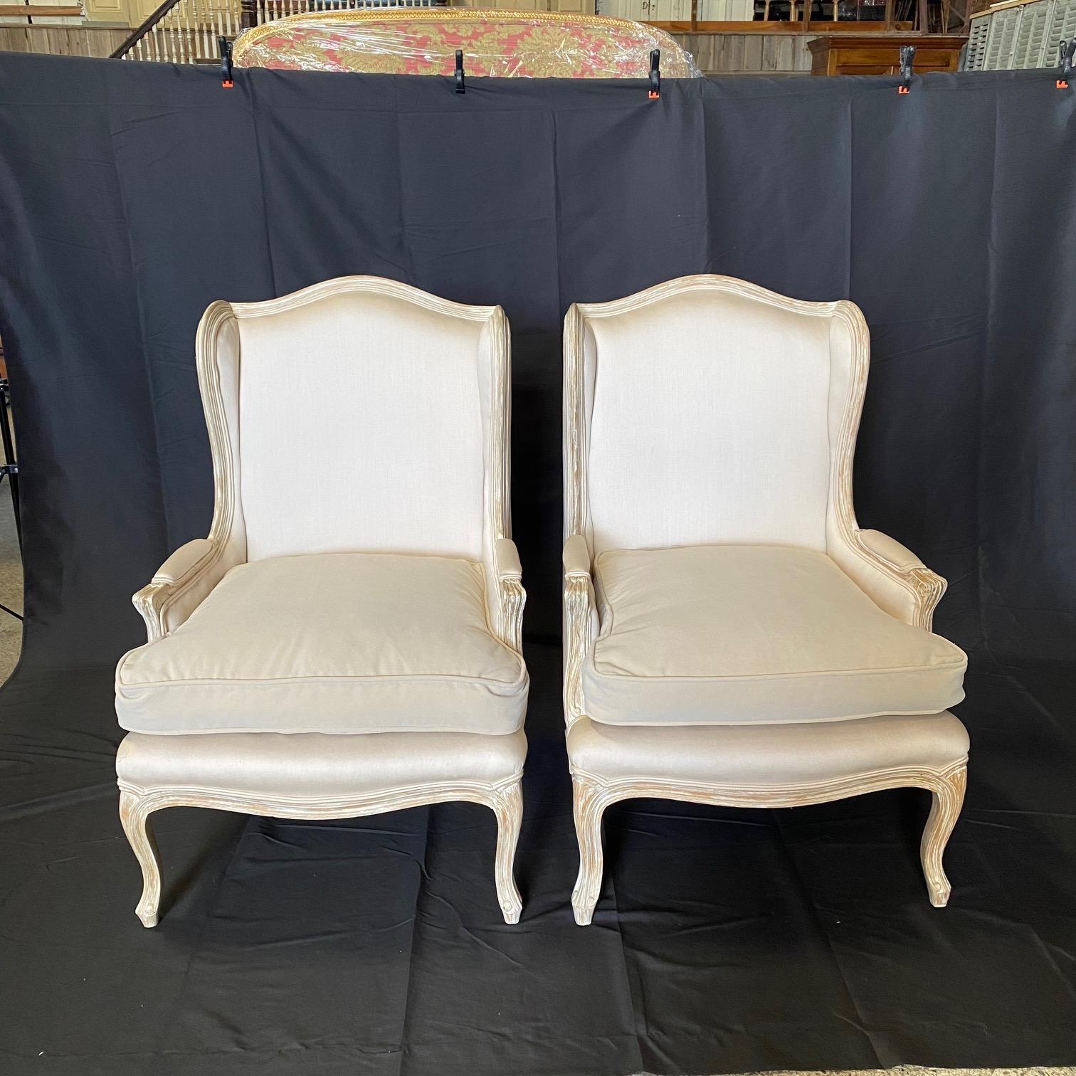 Stately Pair of French Louis XV Style White Bergere Wing Chairs L For Sale 6