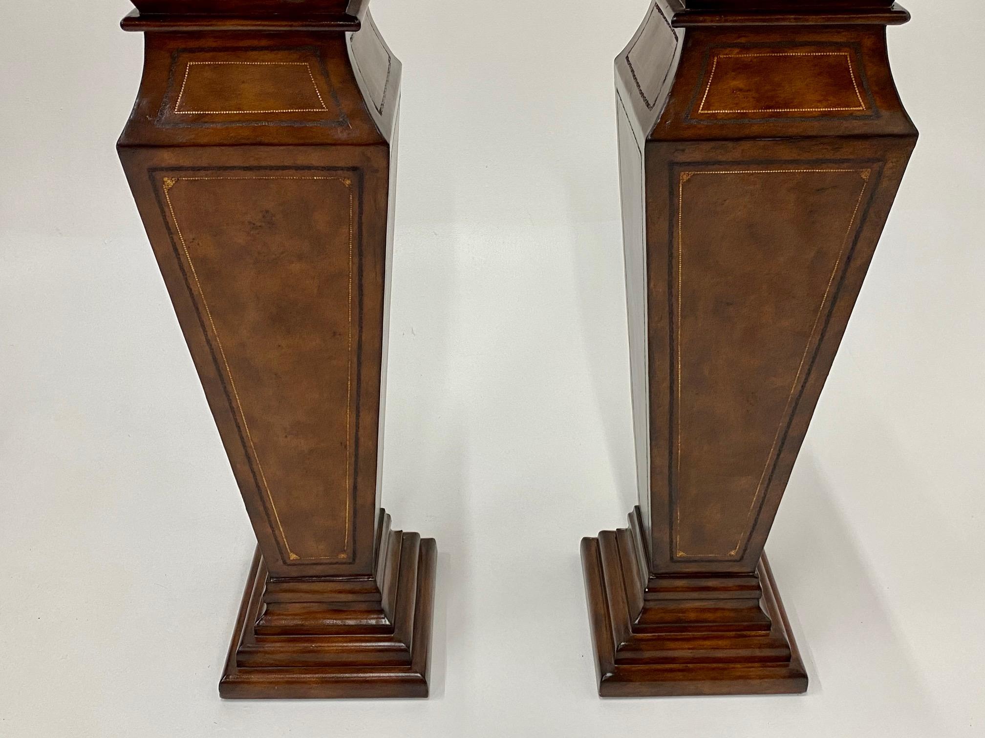 Philippine Stately Pair of Leather Wrapped Pedestals with Gold Embossed Decoration