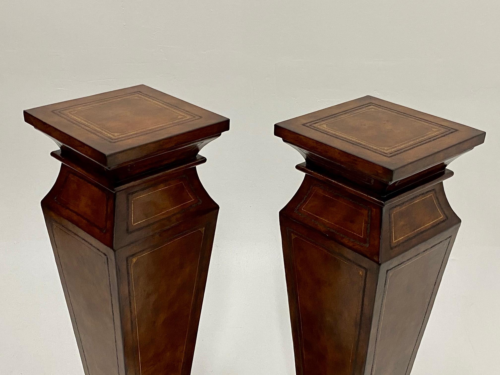 Very handsome large pair of leather wrapped pedestals with beautiful gold embossing.