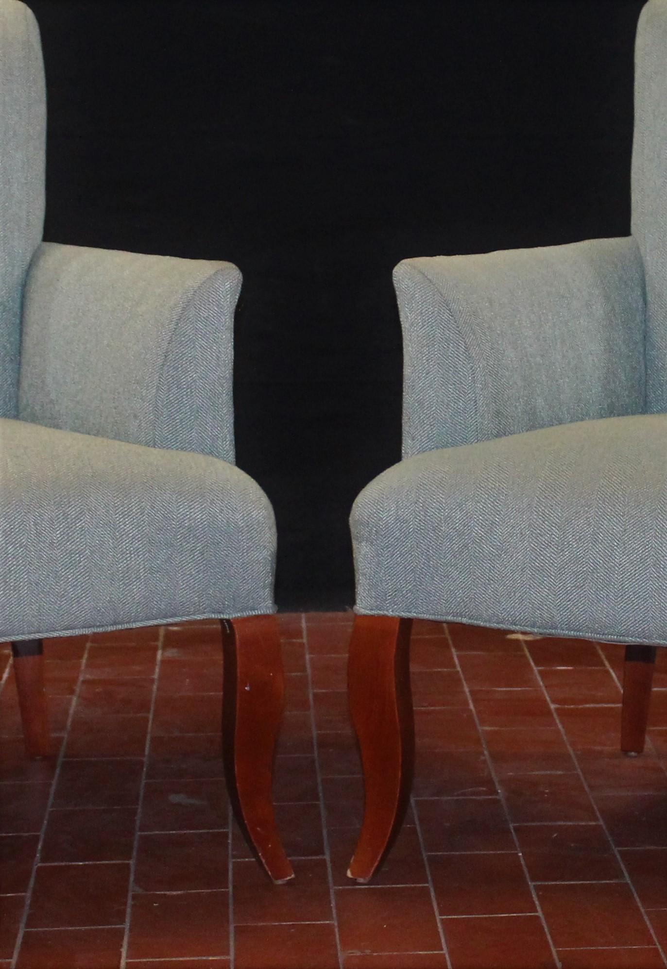 Stately pair of powder blue armchairs. The legs are in a mahogany finish. The arm height is 24 1/2