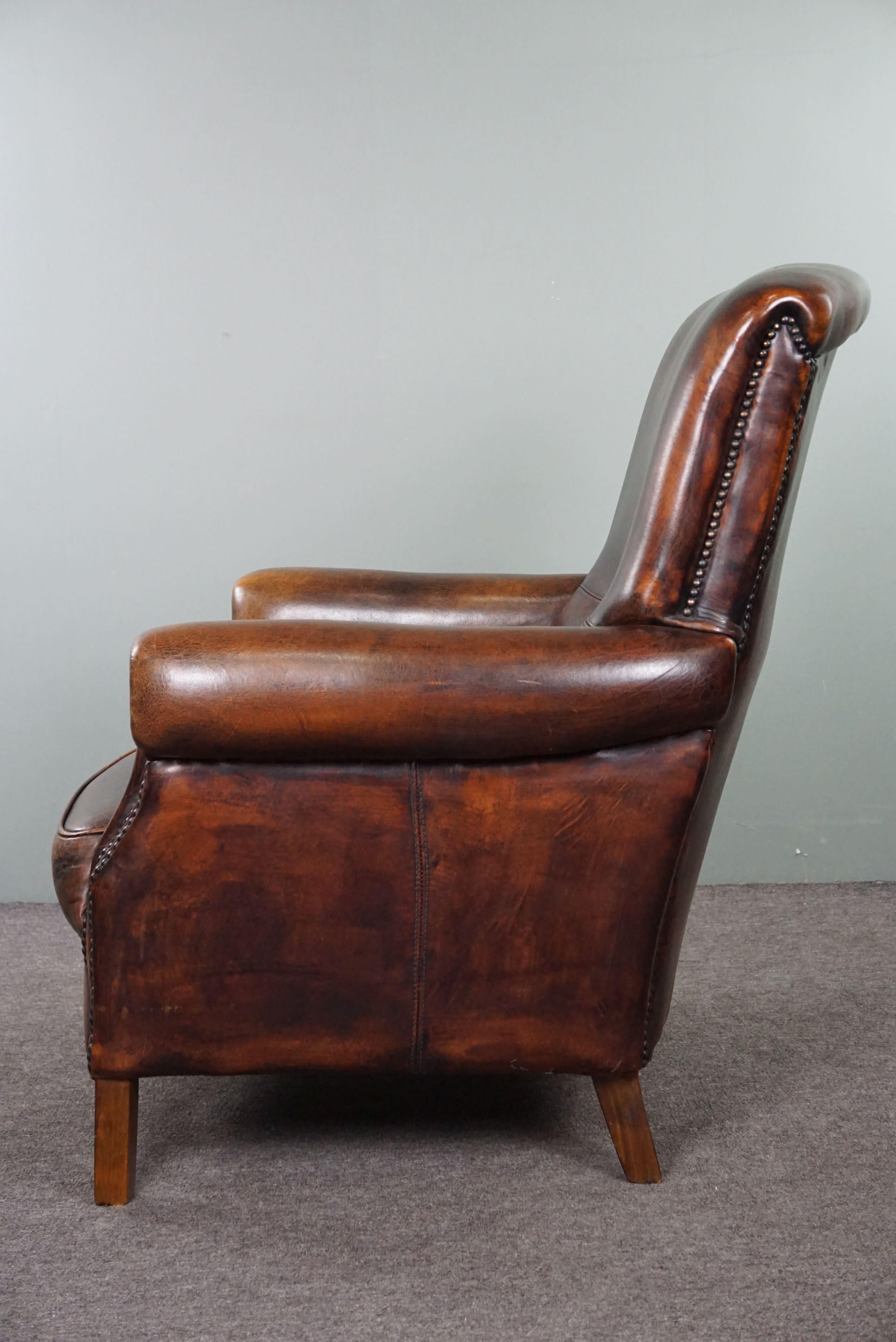 Leather Stately sheep leather armchair, comfortable seat, and high back For Sale