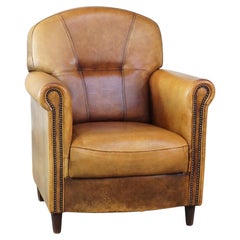 Stately, sleekly finished, comfortable sheepskin armchair