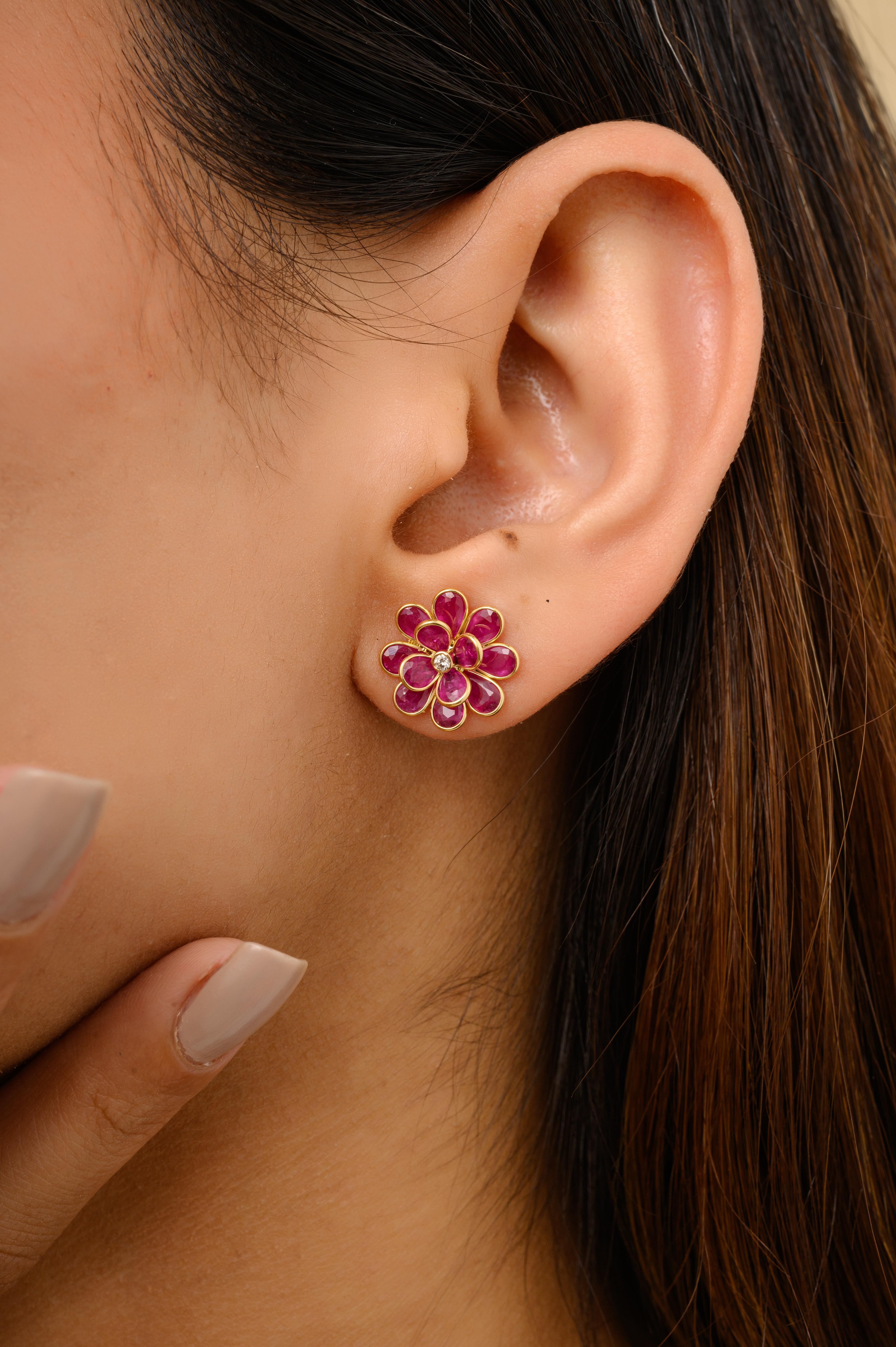 Statement Ruby Blazing Flower Stud Earrings with Diamond in 18K Gold to make a statement with your look. You shall need stud earrings to make a statement with your look. These earrings create a sparkling, luxurious look featuring pear cut ruby.
Ruby