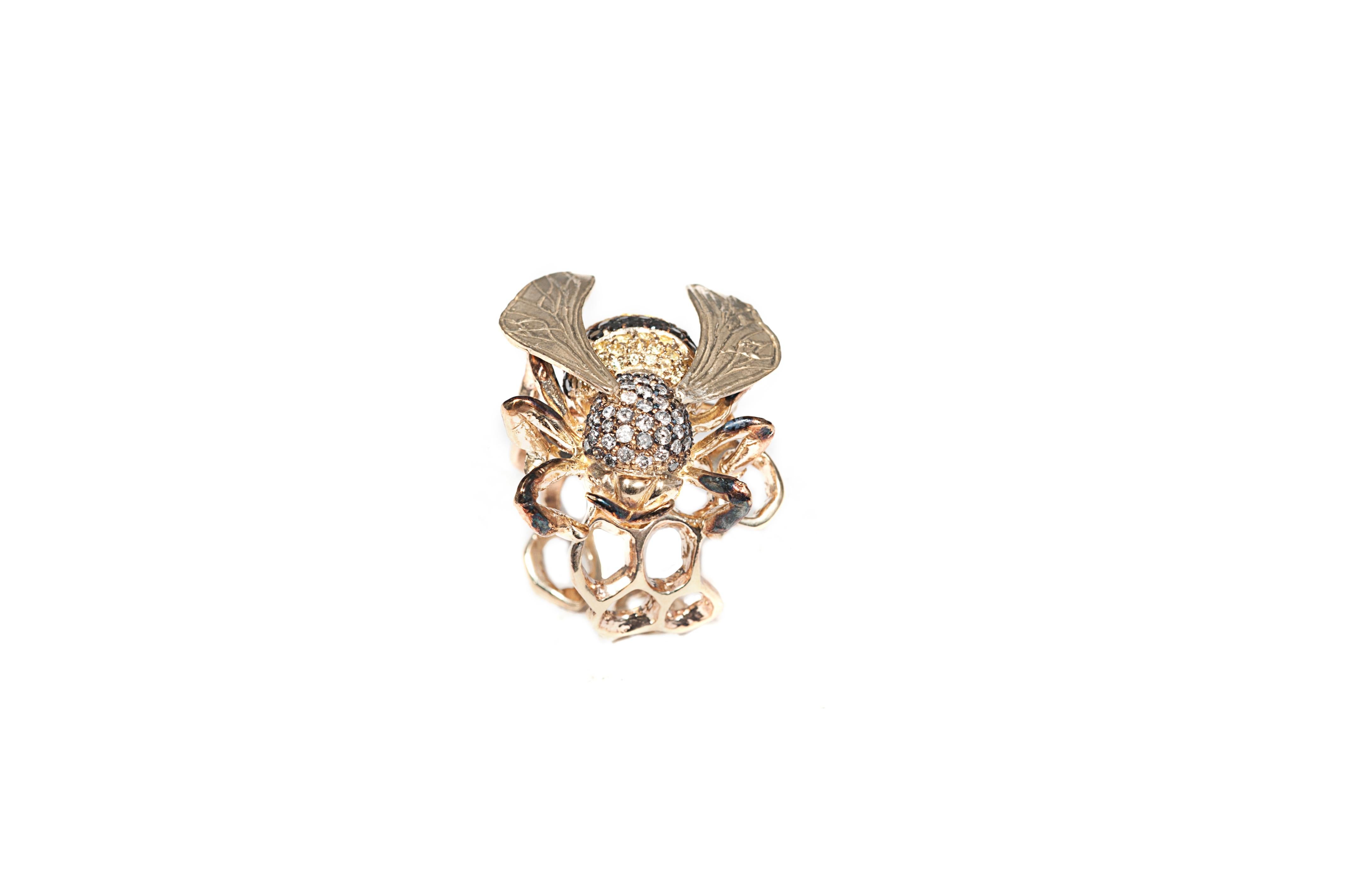 Gold bee ring, animalier style, composition: 
 
Gold 19,54 gr (9K)
60 yellow sapphires 2,10 ct
30 black diamonds 0,95 ct
52 grey diamonds 1,15 ct

Size is adjustable from 6 US to 7 1/4 US ( italian size from 12 to 15)
Other sizes on demand, working