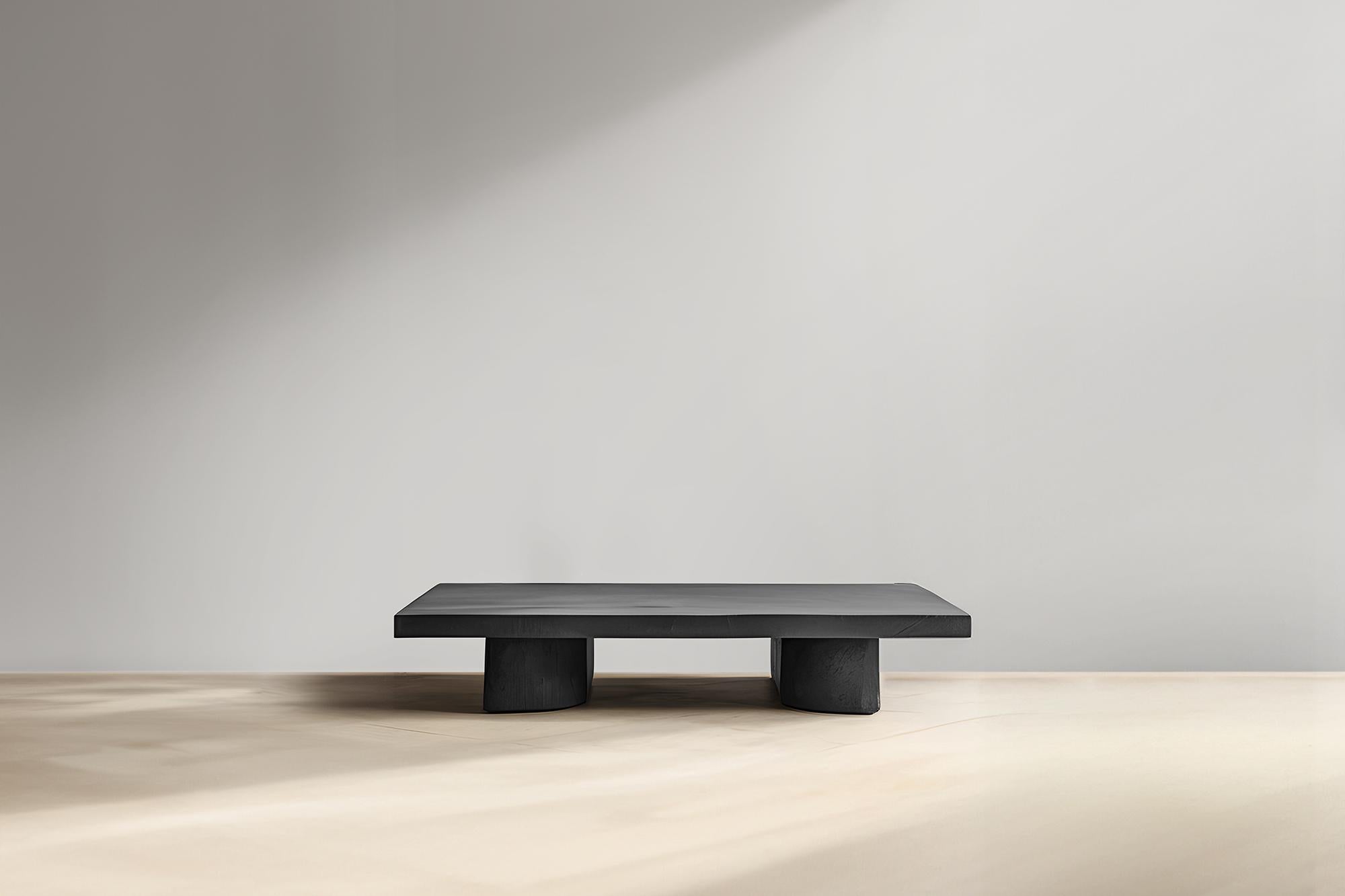Statement Black Rectangular Coffee Table - Fundamenta 32 by NONO


Sculptural coffee table made of solid wood with a natural water-based or black tinted finish. Due to the nature of the production process, each piece may vary in grain, texture,