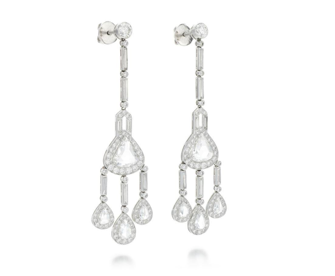 A very beautiful pair of Chandelier earrings, each of chandelier design, set with baguette, brilliant-cut and rose diamonds, post fittings.
Butterfly clips stamped PLAT. Largest rose diamonds each measuring approximately 8.6 x 7.6 x 2.09. Estimated