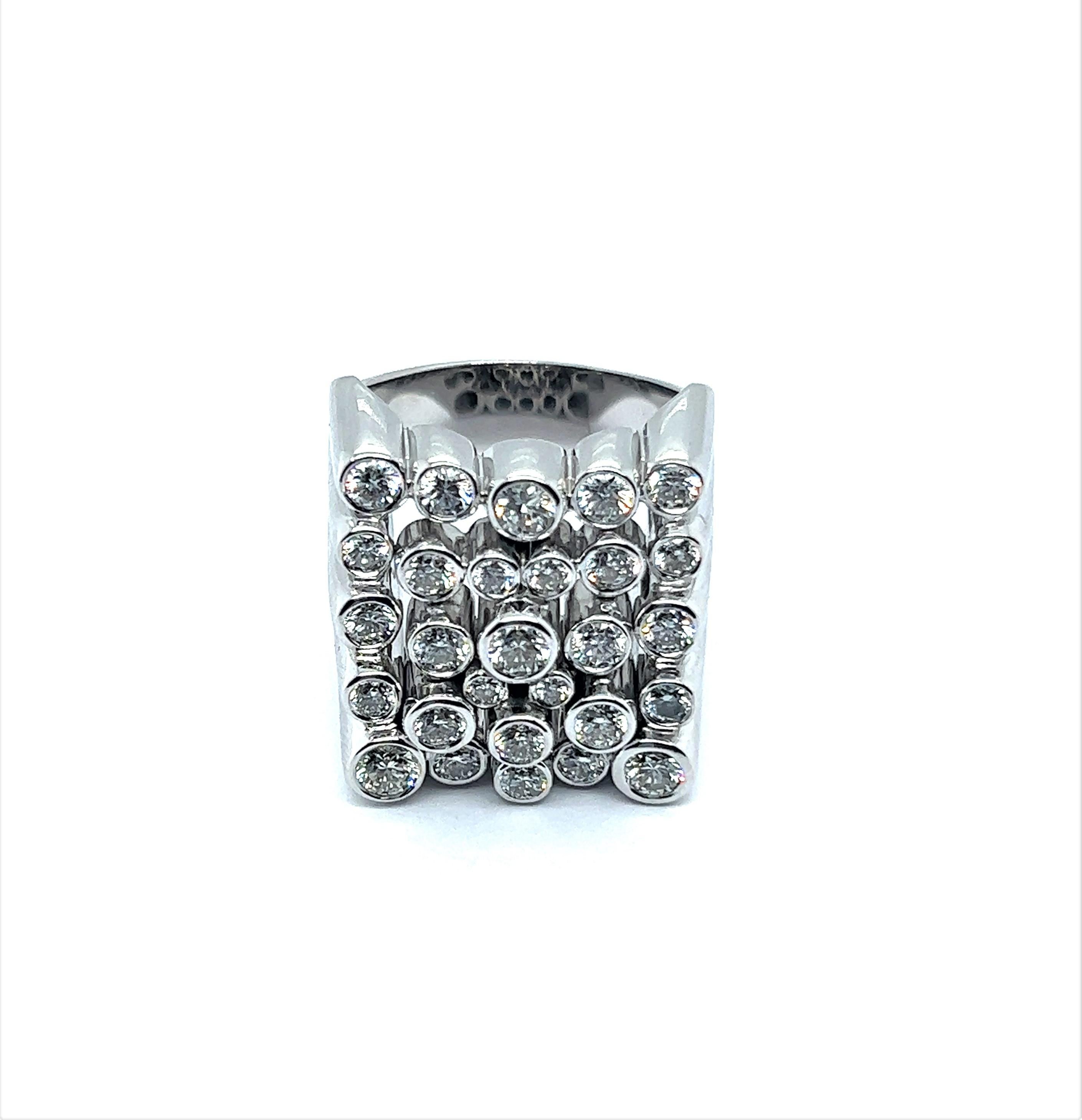 Indulge your senses in an exquisite jewellery creation - a statement diamond ring that effortlessly marries boldness with refined elegance. This exceptional piece is an ode to contemporary design and geometric architectural inspiration, exuding a