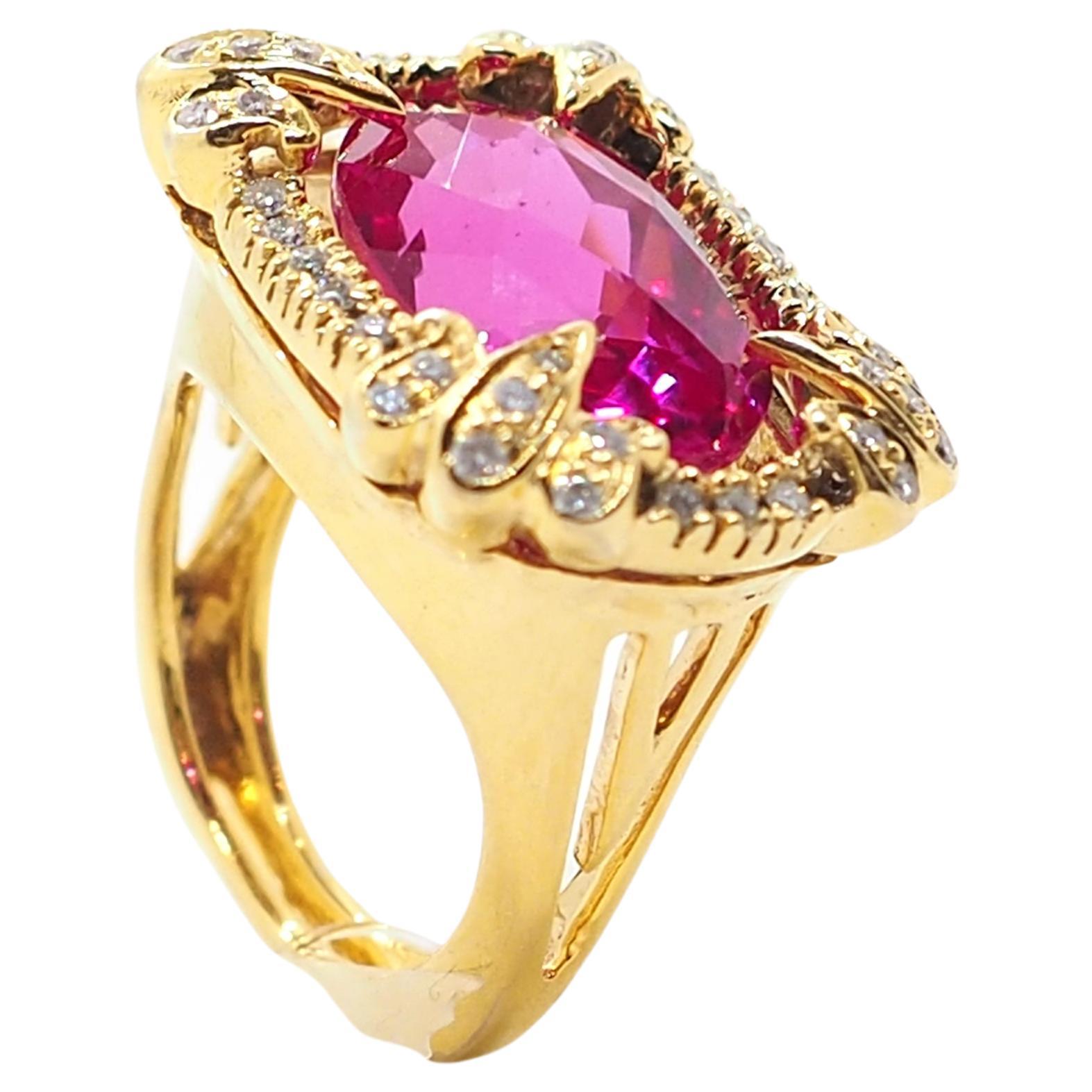 Statement beautiful ring crafted in a 18k yellow gold and decorated with an oval shape synthetic ruby 12*15 mm and 44 diamonds of 1,2 carats. 

Eu size: 55 
Weight: 17g

All our pieces have been carefully chosen, restored and prepared for our