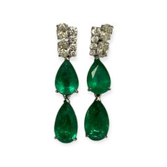 Statement Double Pear shaped emeralds and mixed oval and round brilliant cut dia