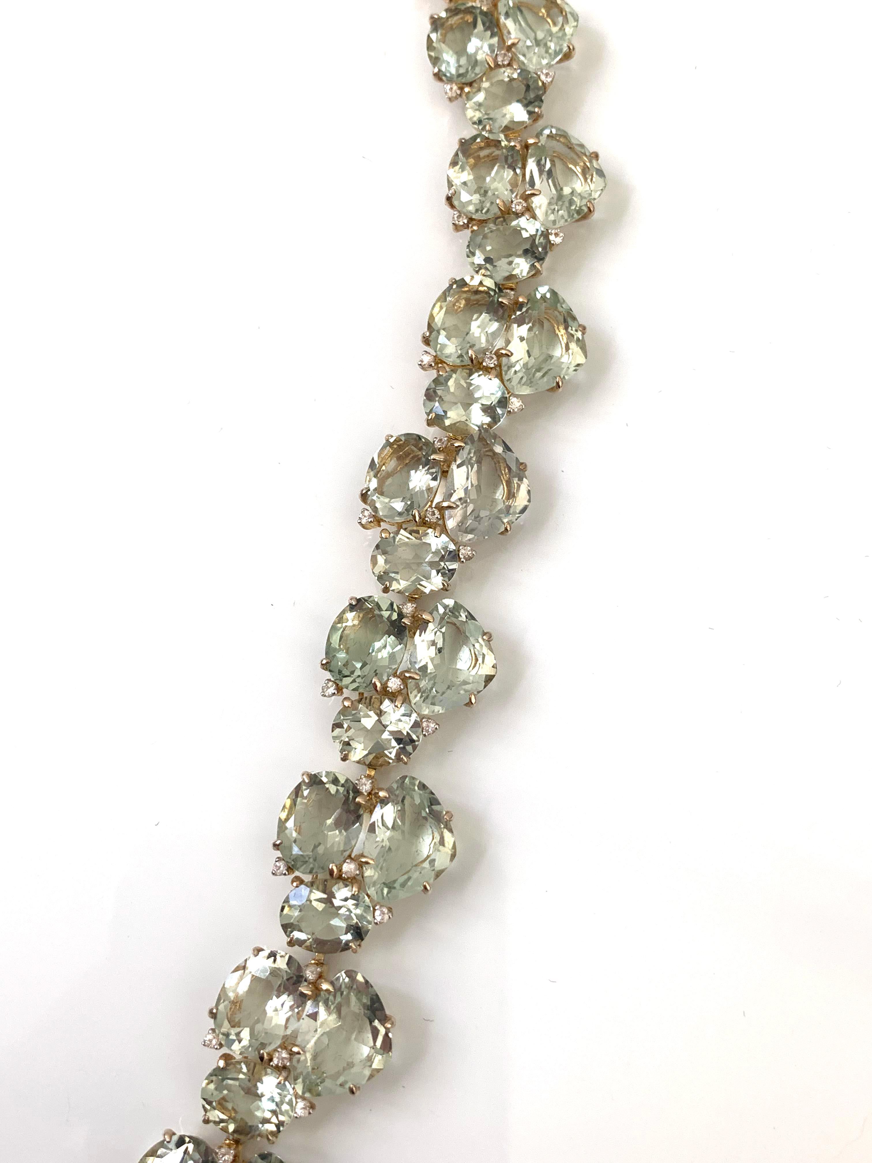Elegant Green Amethyst and White Sapphire Bracelet. 70 pieces of concave-cut triangle green amethyst, oval green amethyst, and round white sapphires individually handset in vermeil 18k gold plated sterling silver. Push clasp lock with double safety