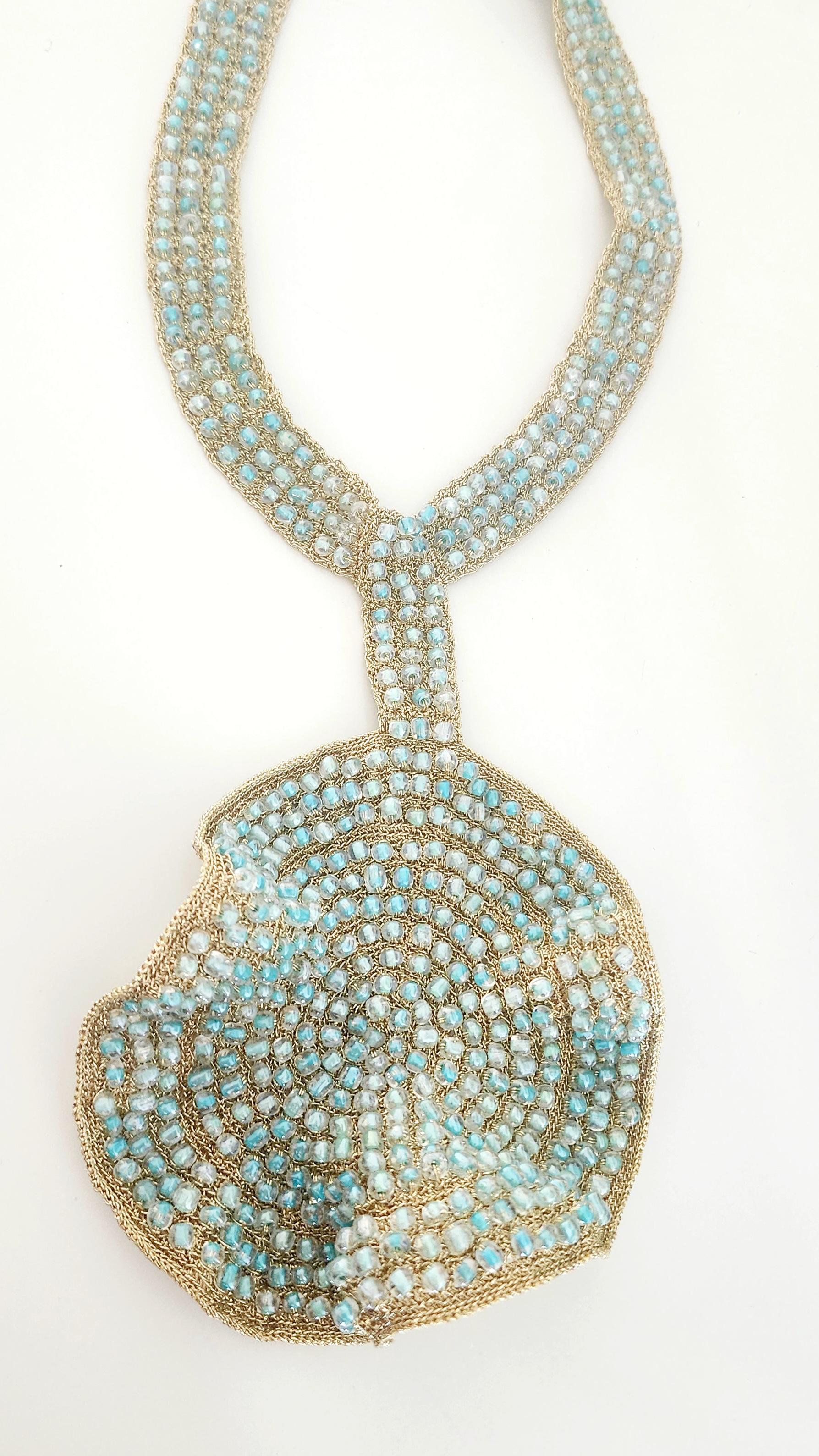 Beautiful, intricate, one of a kind, statement necklace. It is hand crochet with Light golden smooth passing thread and Light Blue Glass seed beads. This piece is a conversation starter. It was inspired by the adornments of the great priests of