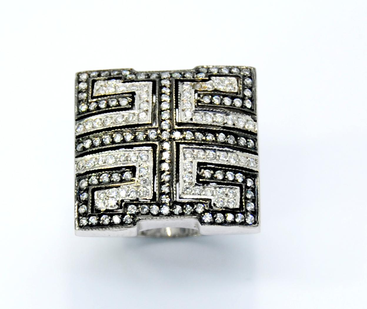 .Statement Mosaic Ring in White and Black Diamonds in 18 Karat White Gold 
These collection is inspired in classicism and retro style but the gemstones are modern and vibrant.
This ring has total of 1,55ct 
Ring Size 55 Europe,  US 7 1/4 
Can be