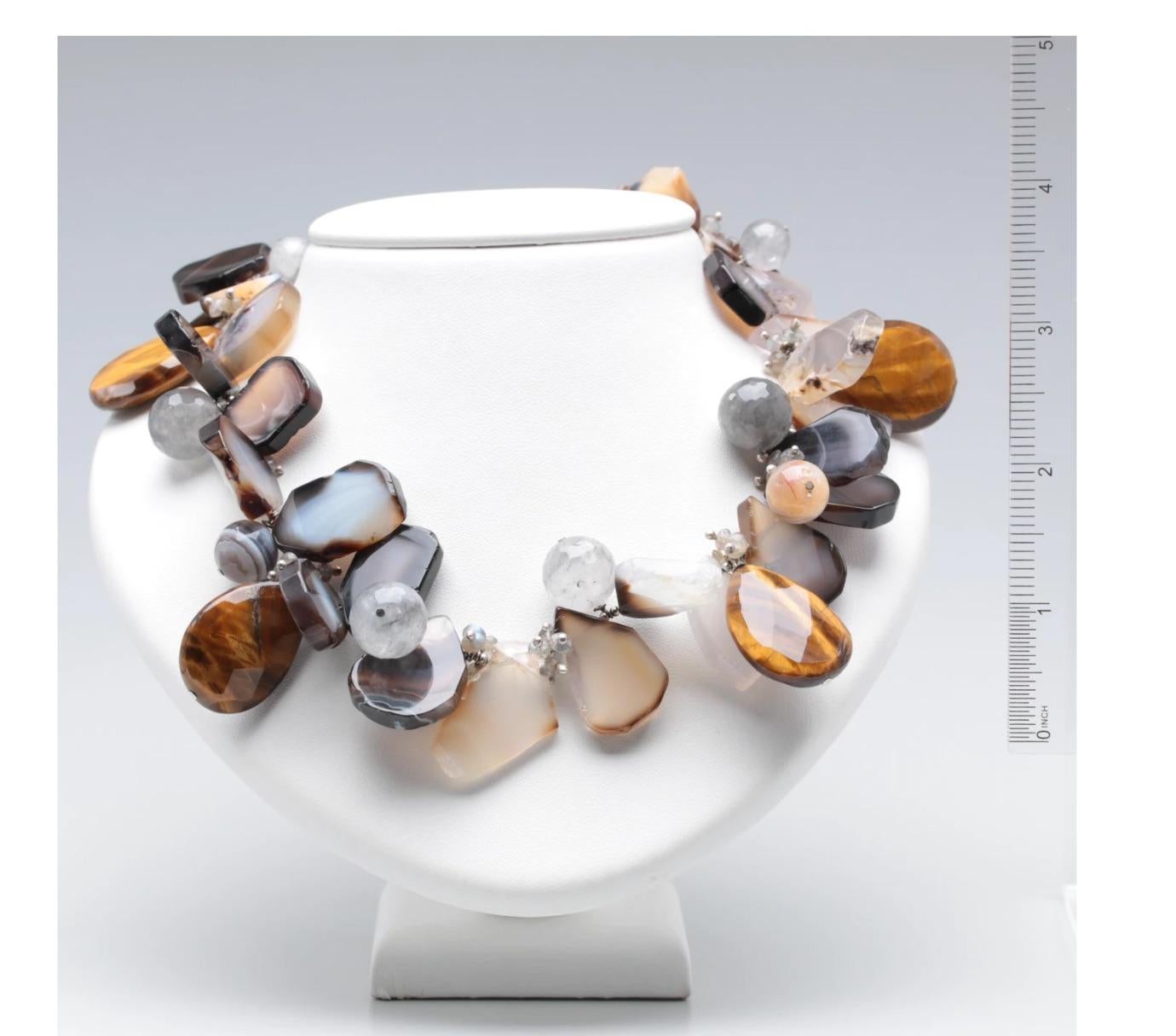 Modern Statement Necklace-Gorgeous Bountiful Semi Precious Stones of Various Hand Selected Shapes and Sizes of Agate and Tiger's Eye and Sterling to Surround your Neck with Style and Sophistication. by Designer Artisan- Amy Kahn Russell
Label AKR