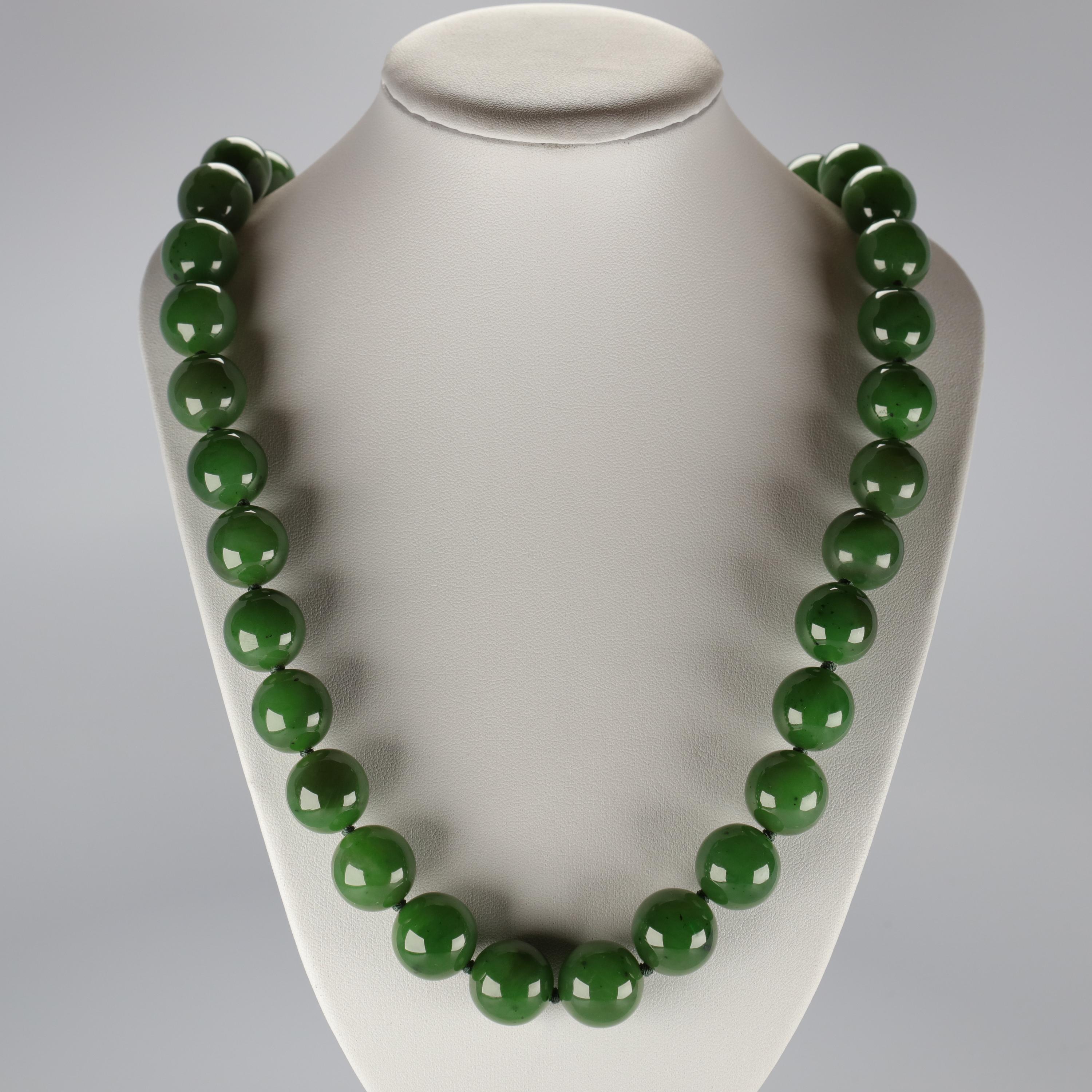 This statement necklace of enormous jade beads with an 18K yellow gold diamond-studded ball clasp is almost beyond description, but I will try.  As a certified professional gemologist and a second-generation jade collector who has had the privilege