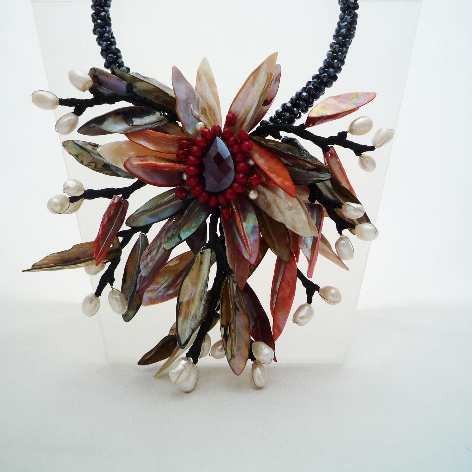 Statement necklace pearls, sea shells and Swarovski stones
Opulent necklace in the shape of a sea flower. 
The materials coming from the water are artfully combined, so that the impression of a flower from the sea is created.
Handcrafted, Modern