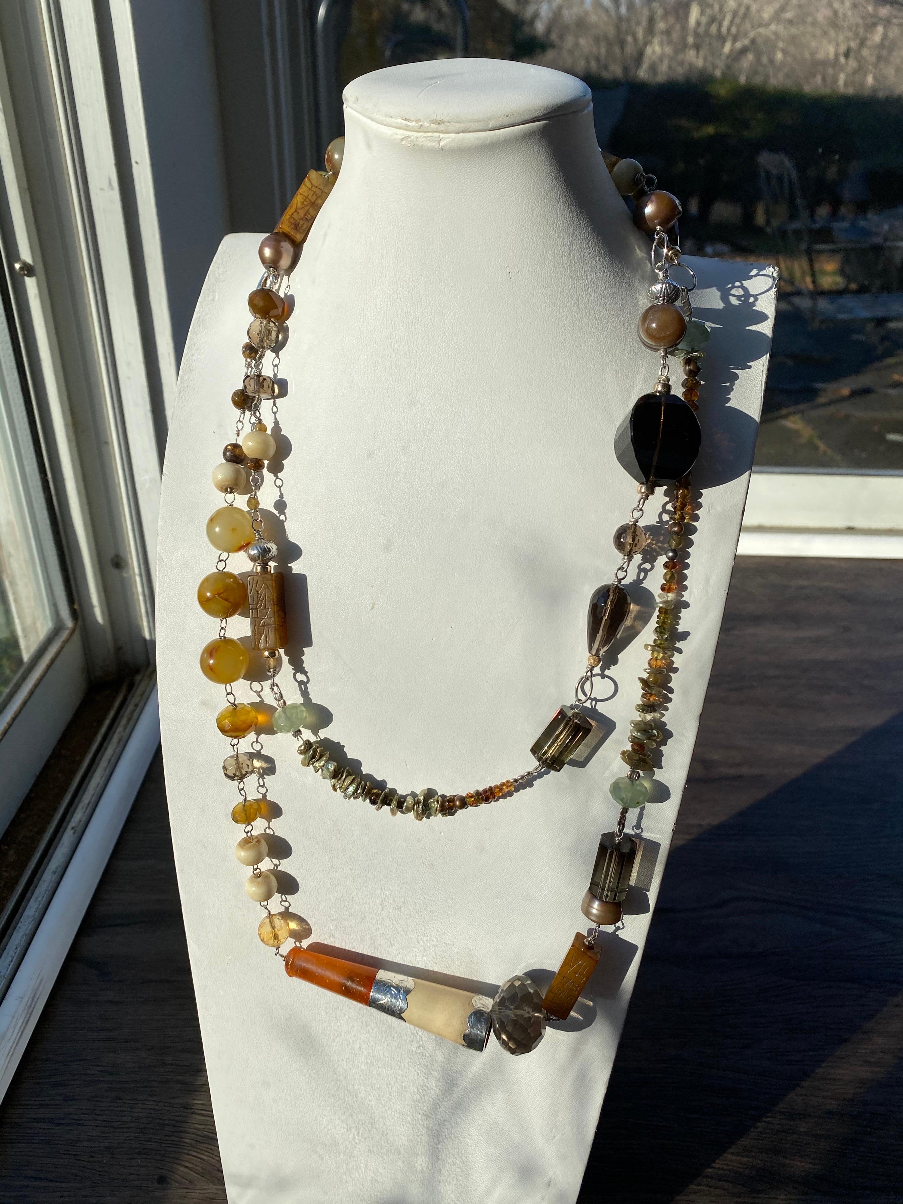From the Jane Magon Collections, Australian Landscape comes this one of a kind dramatic long necklace with an impressive array of gemstones. Citrines, monkey Quartz, Jades, Jaspers, Chalcedony, Dyed Keshi Pearls, Brown Freshwater Pearls, Carved tiny