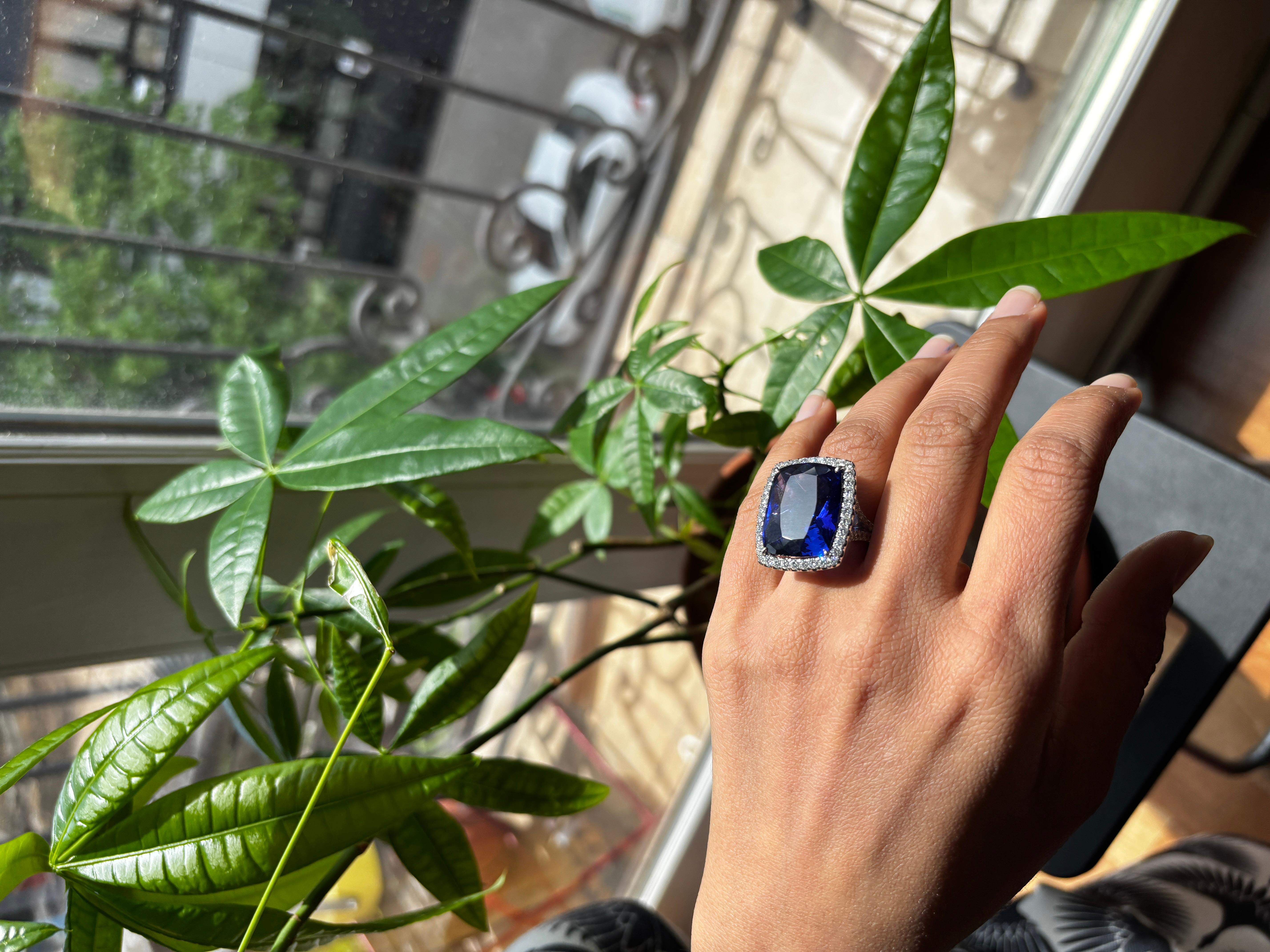 Vintage Tanzanite and Diamond Ring  33-35 Carat Deep Blue Tanzanite  Approx 2.50 Carat Natural Diamonds  VS-SI Clarity

Exuding timeless elegance and rare beauty, this exquisite vintage ring features a breathtaking deep blue tanzanite with an