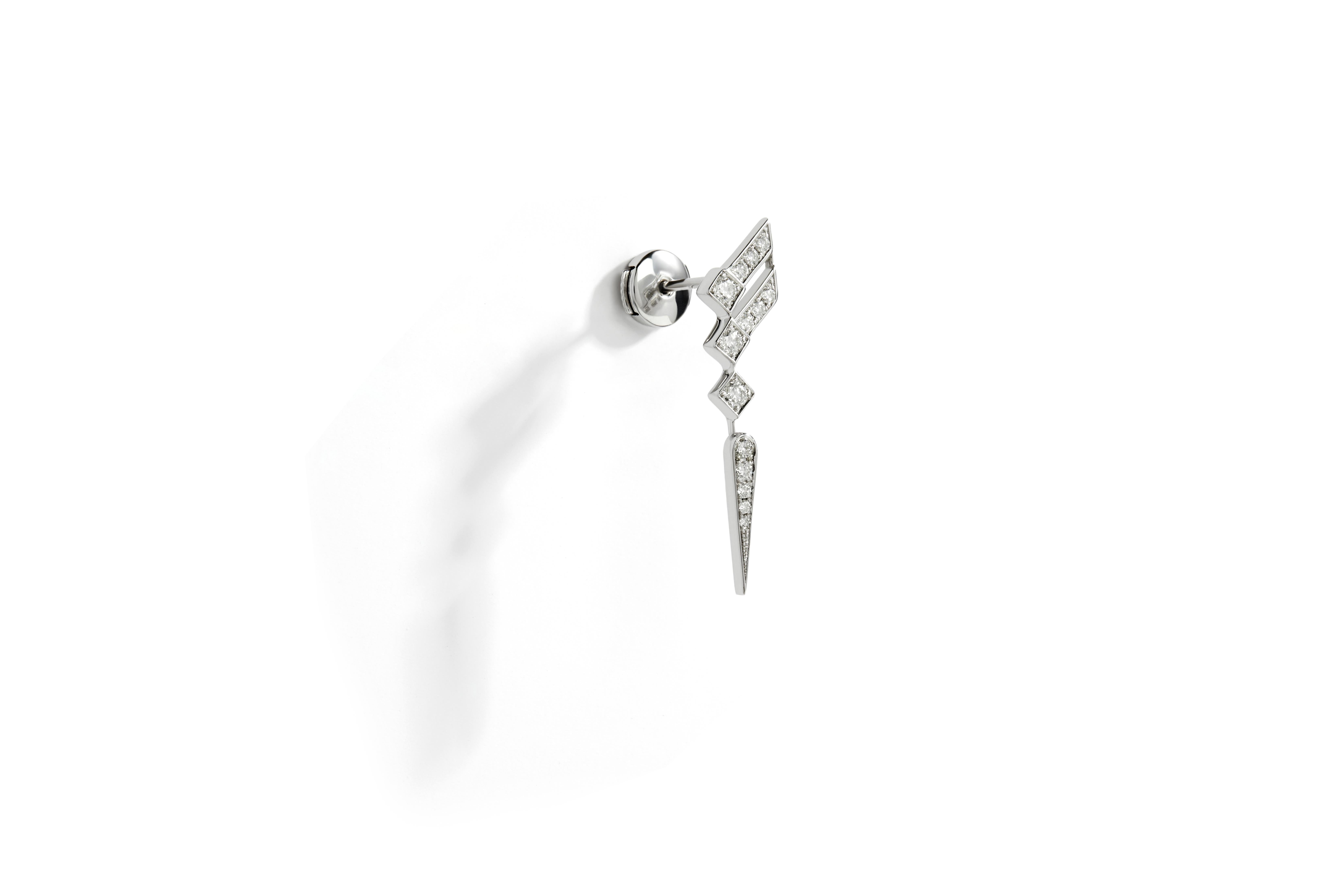 Earring Stairway Wings in rhodium plated sterling silver, set with 14 brilliant-cut diamonds quality G-VS, totaling 0,35 carat. 

This wing-shaped earring in rhodium plated 925 silver paved with natural diamonds is inspired by the structural