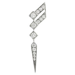 DÉCLARATION Paris, Boucles d'oreilles unitées ailes d'escalier en diamants et argent 0,35 carat à gauche