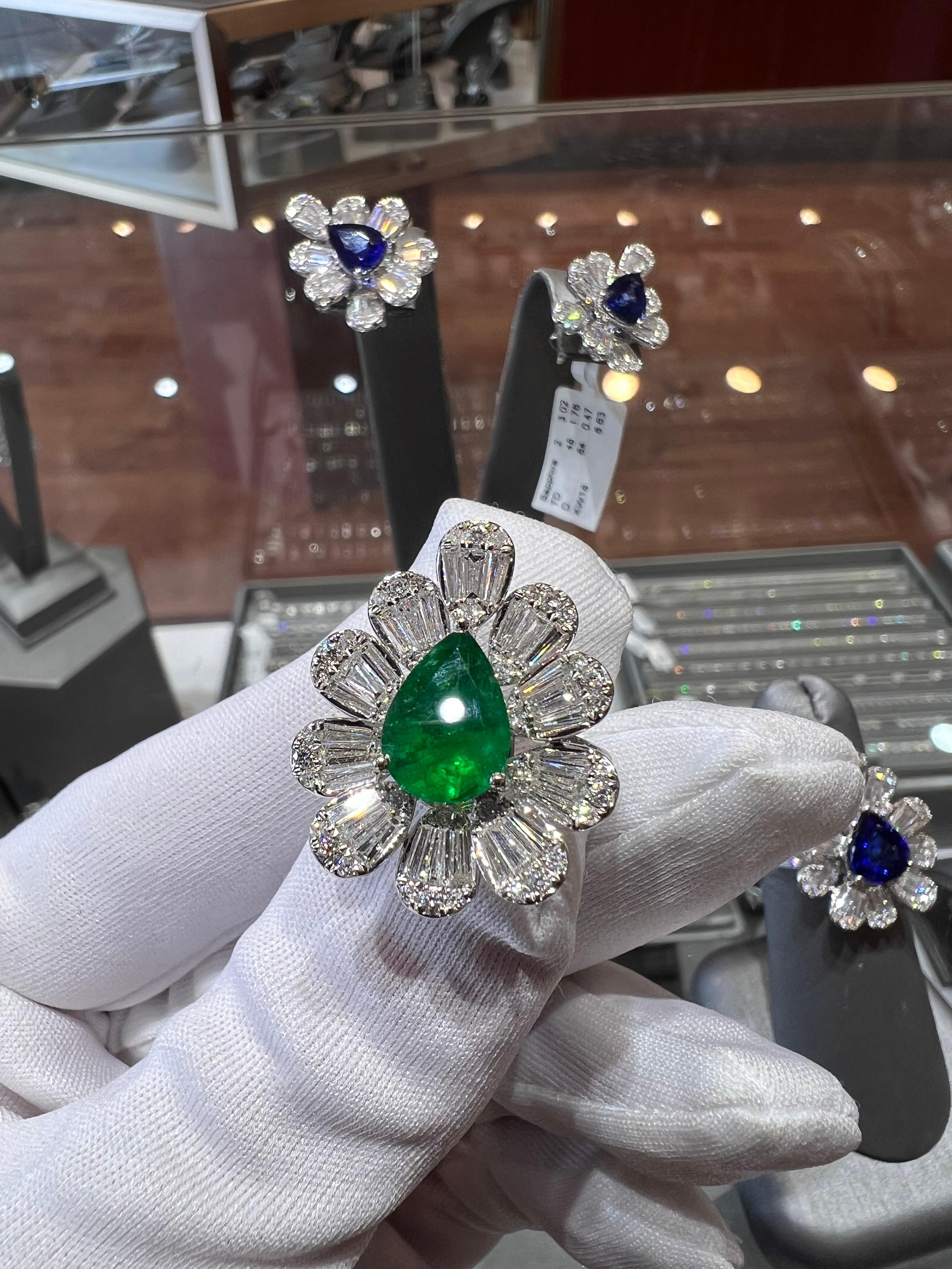 Spontaneous Pear-shape Brilliant-Cut Natural Zambian Emerald. An 18k white gold (750 hallmark), this ring has a center stone of 2.51ct, a beautiful candy color green emerald, set in a three-prong basket setting. Surrounded by excellent quality