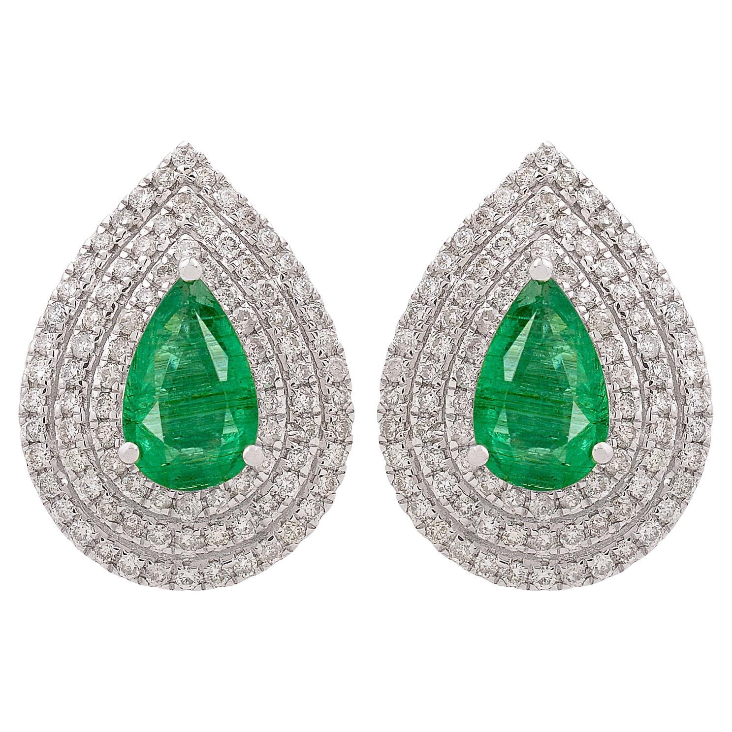 Orecchini dichiarati a pera con diamante smeraldo e triplo alone in oro bianco 18 carati
