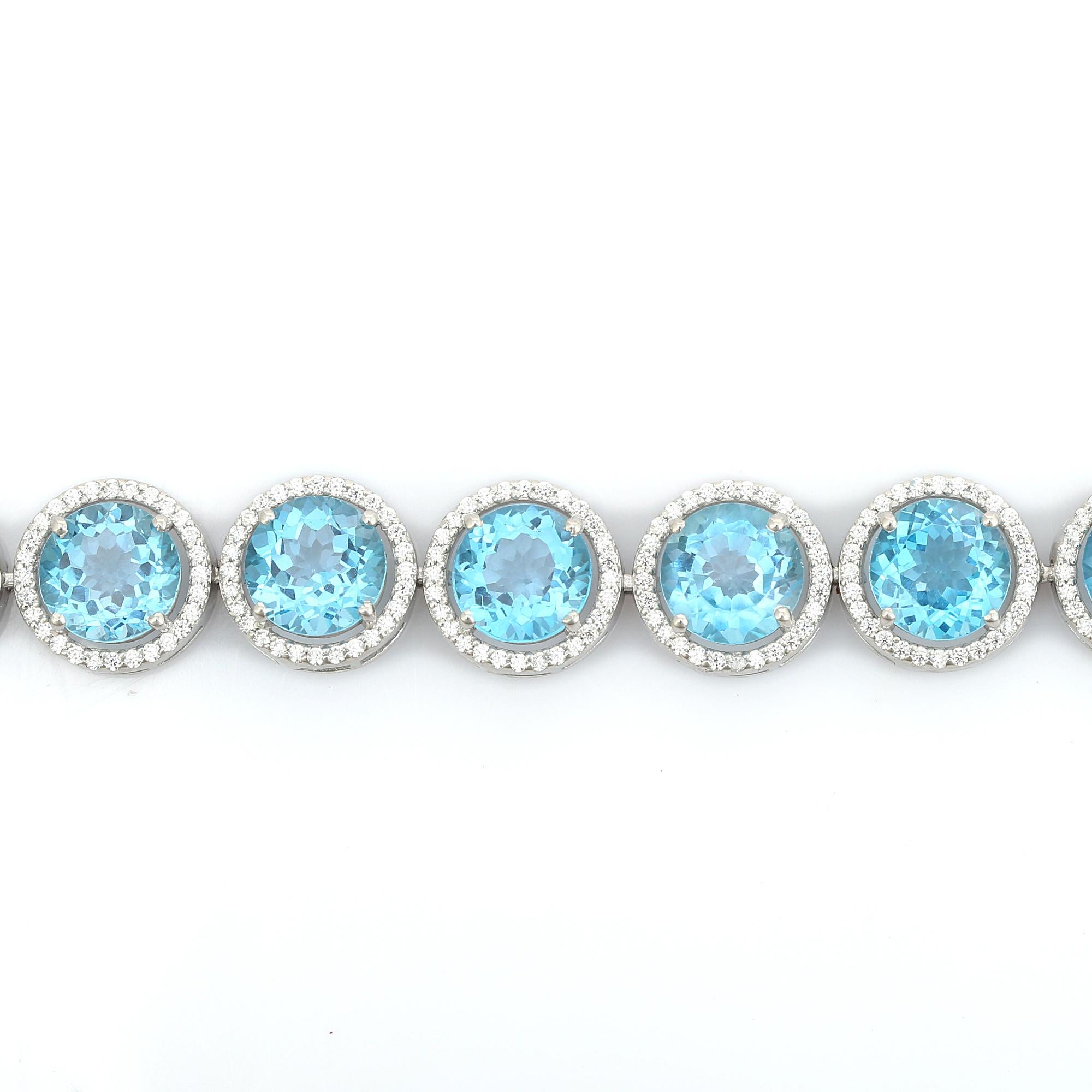 De las mujeres Pulsera de plata con topacio azul redondo y halo de circonitas para regalar en venta